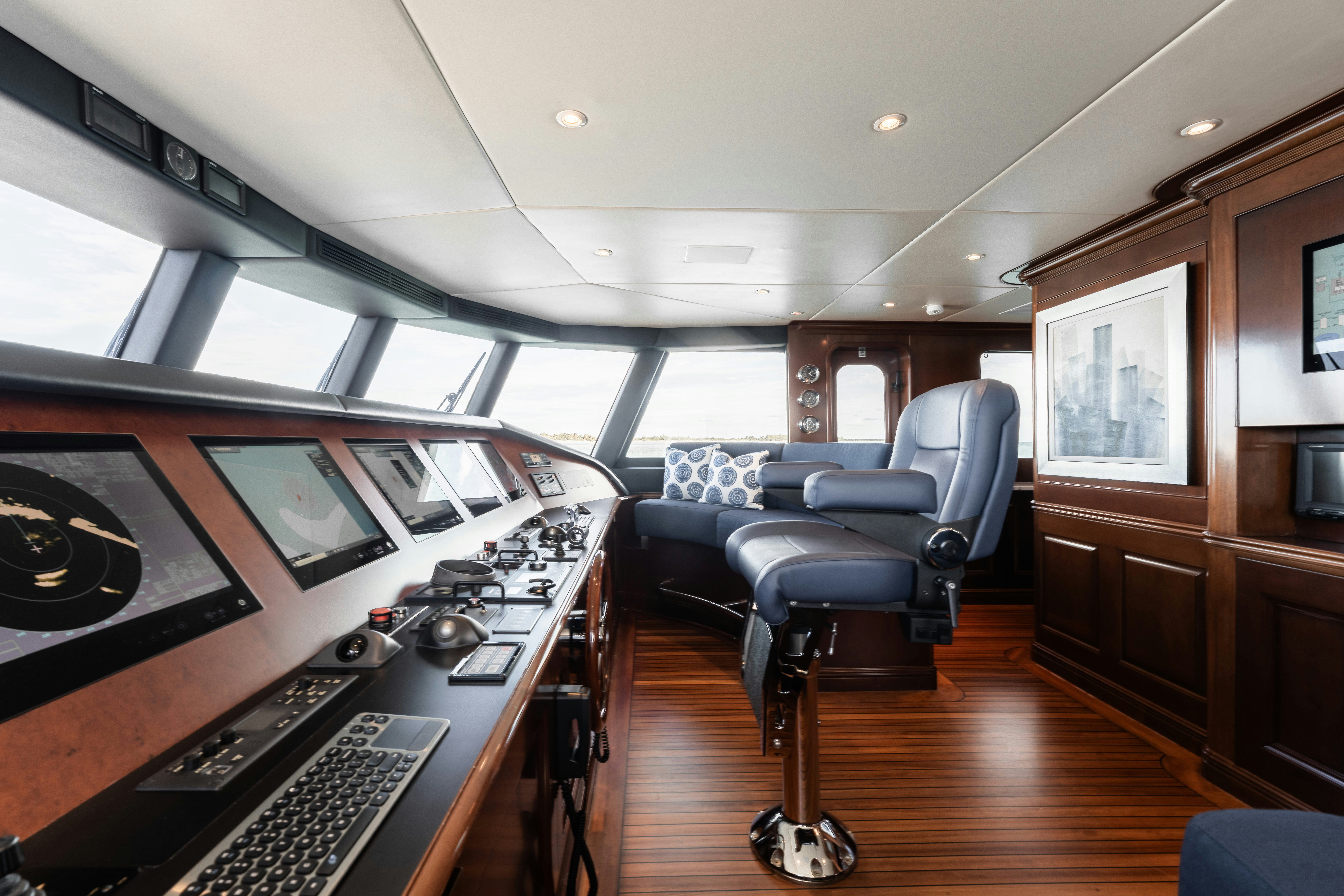 a room with a large table and chairs and a large window aboard SUMMERDANCE Yacht for Sale