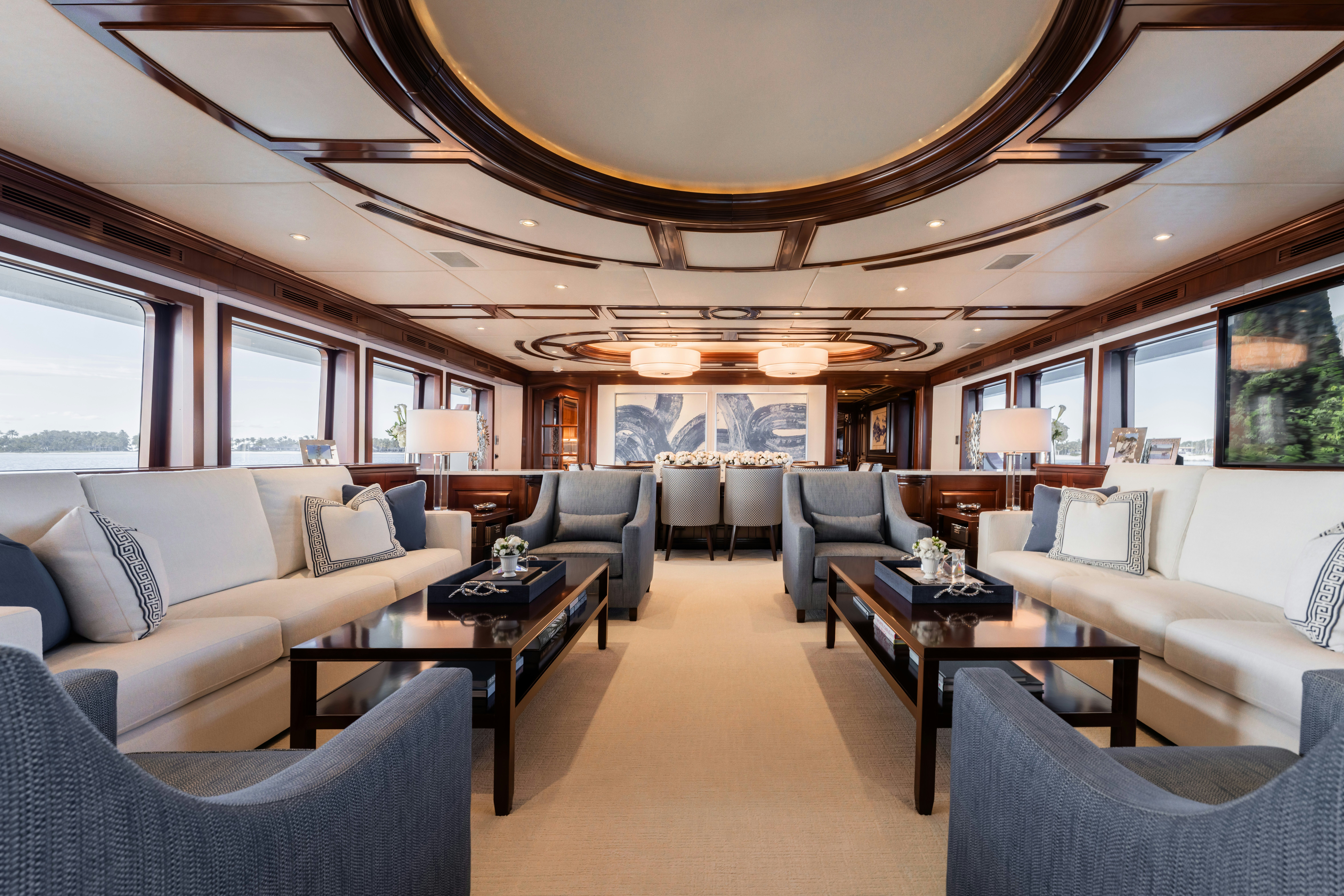 a living room with a large sofa and a coffee table aboard SUMMERDANCE Yacht for Sale