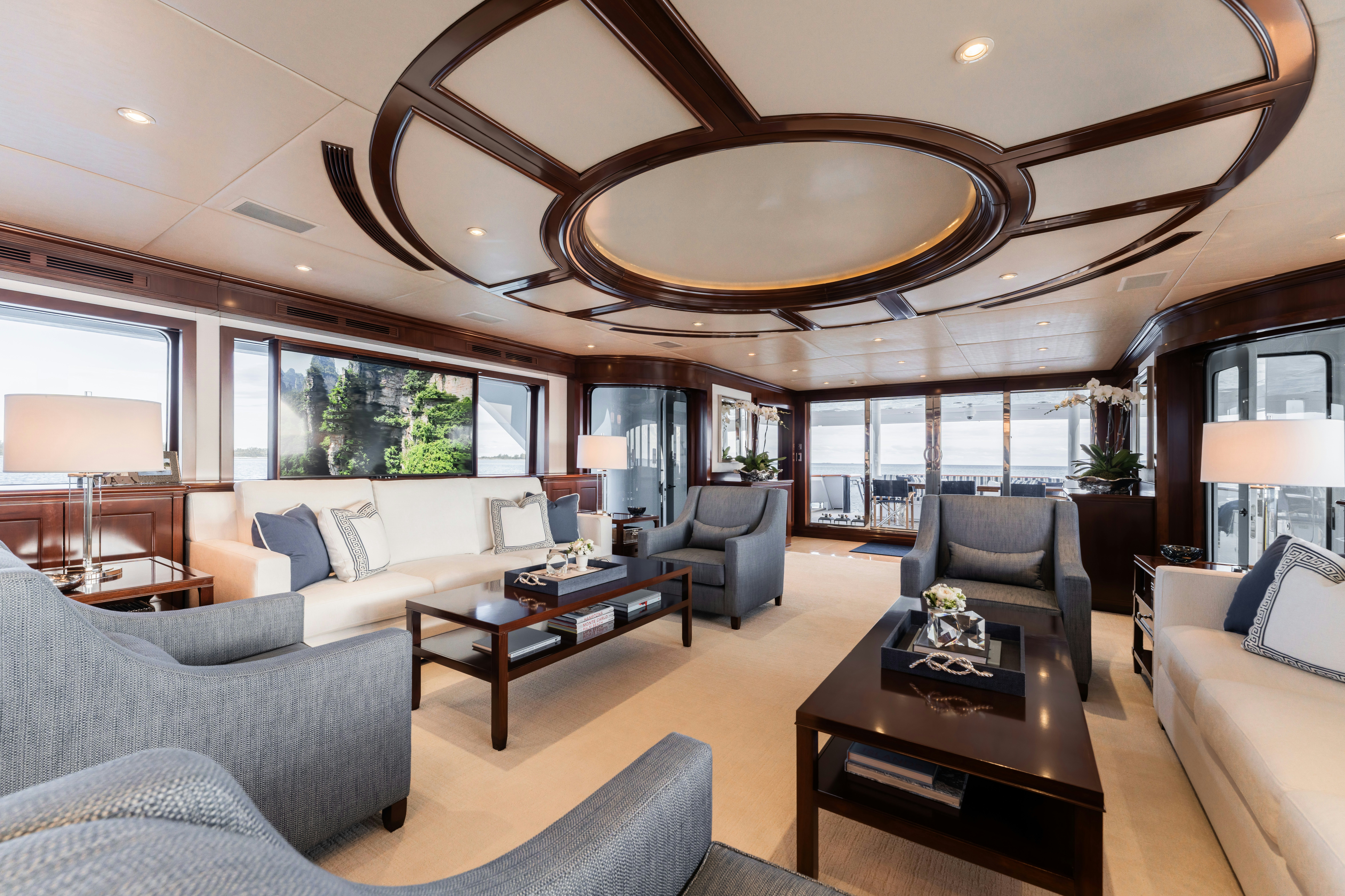 a living room with a large chandelier aboard SUMMERDANCE Yacht for Sale