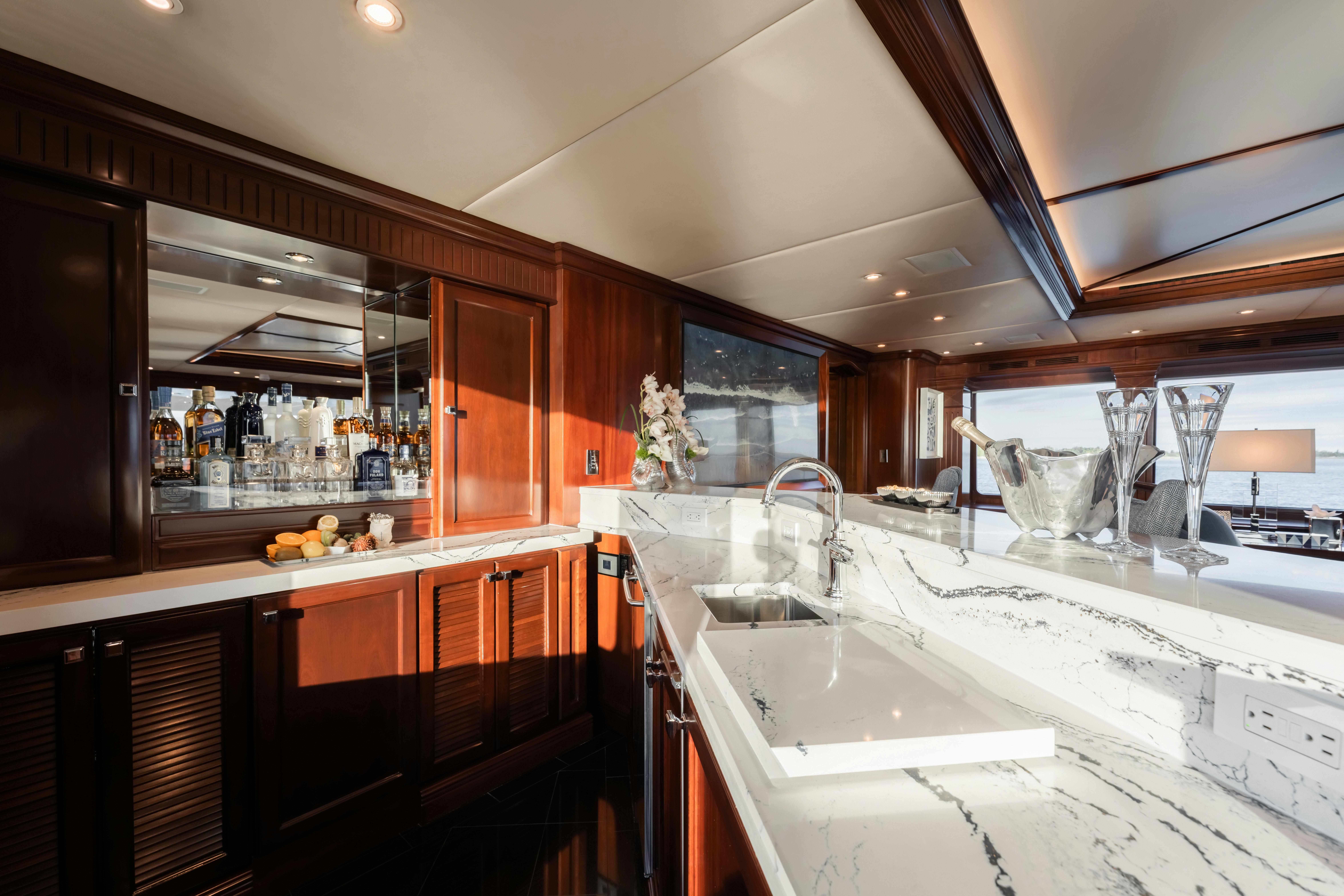 a kitchen with wooden cabinets aboard SUMMERDANCE Yacht for Sale