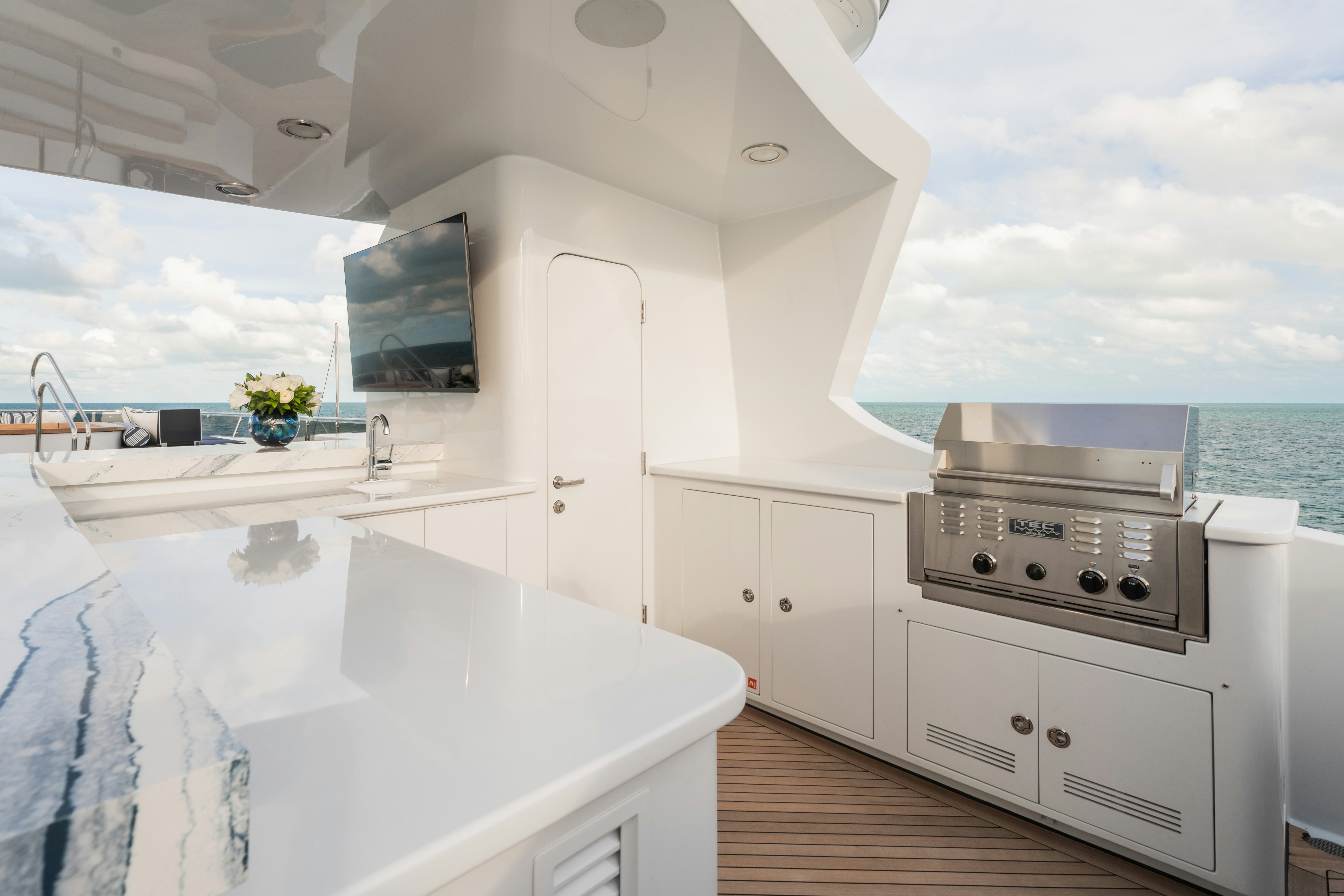 a kitchen with a large white counter aboard SUMMERDANCE Yacht for Sale