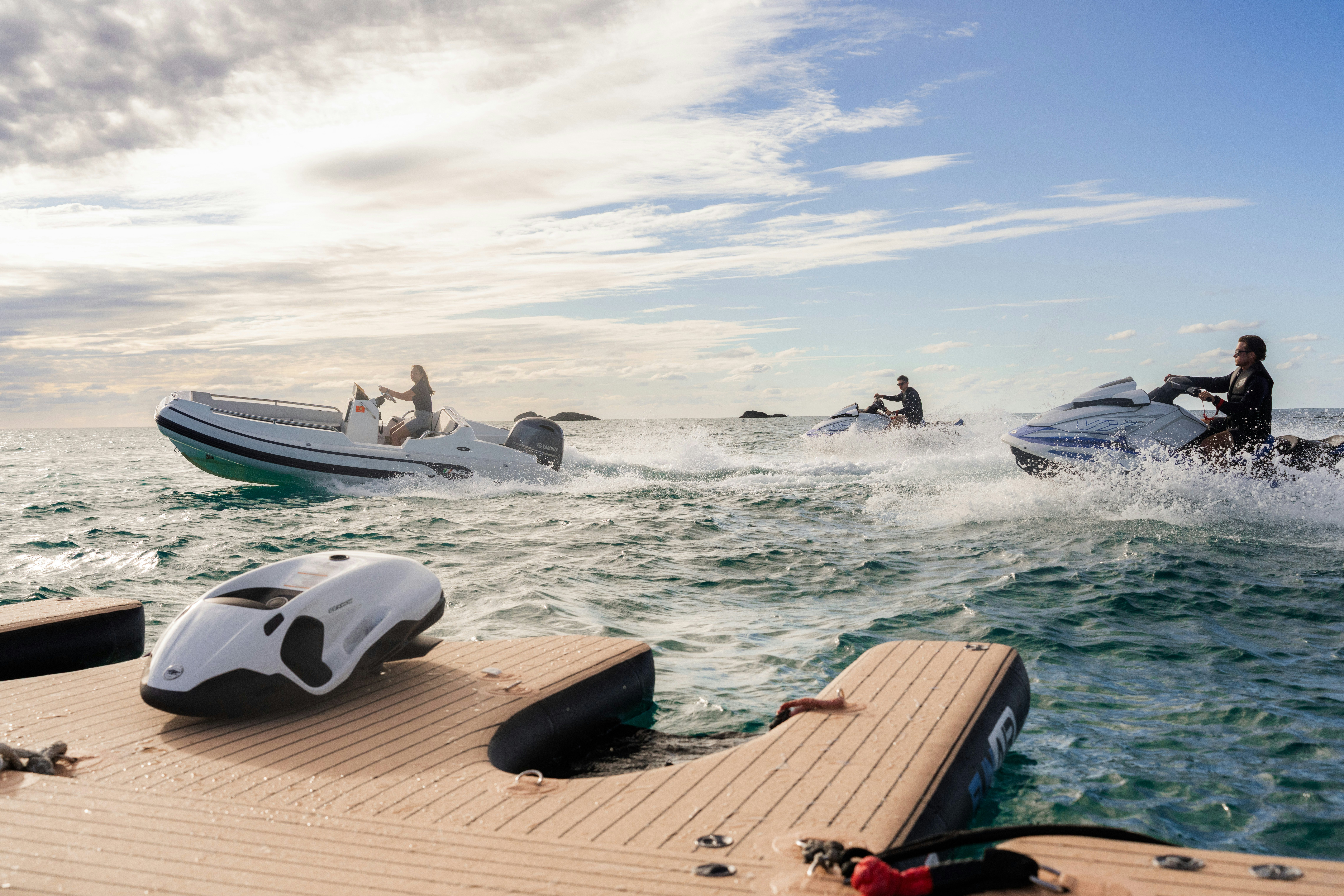 a group of people in the water with boats in the water aboard SUMMERDANCE Yacht for Charter