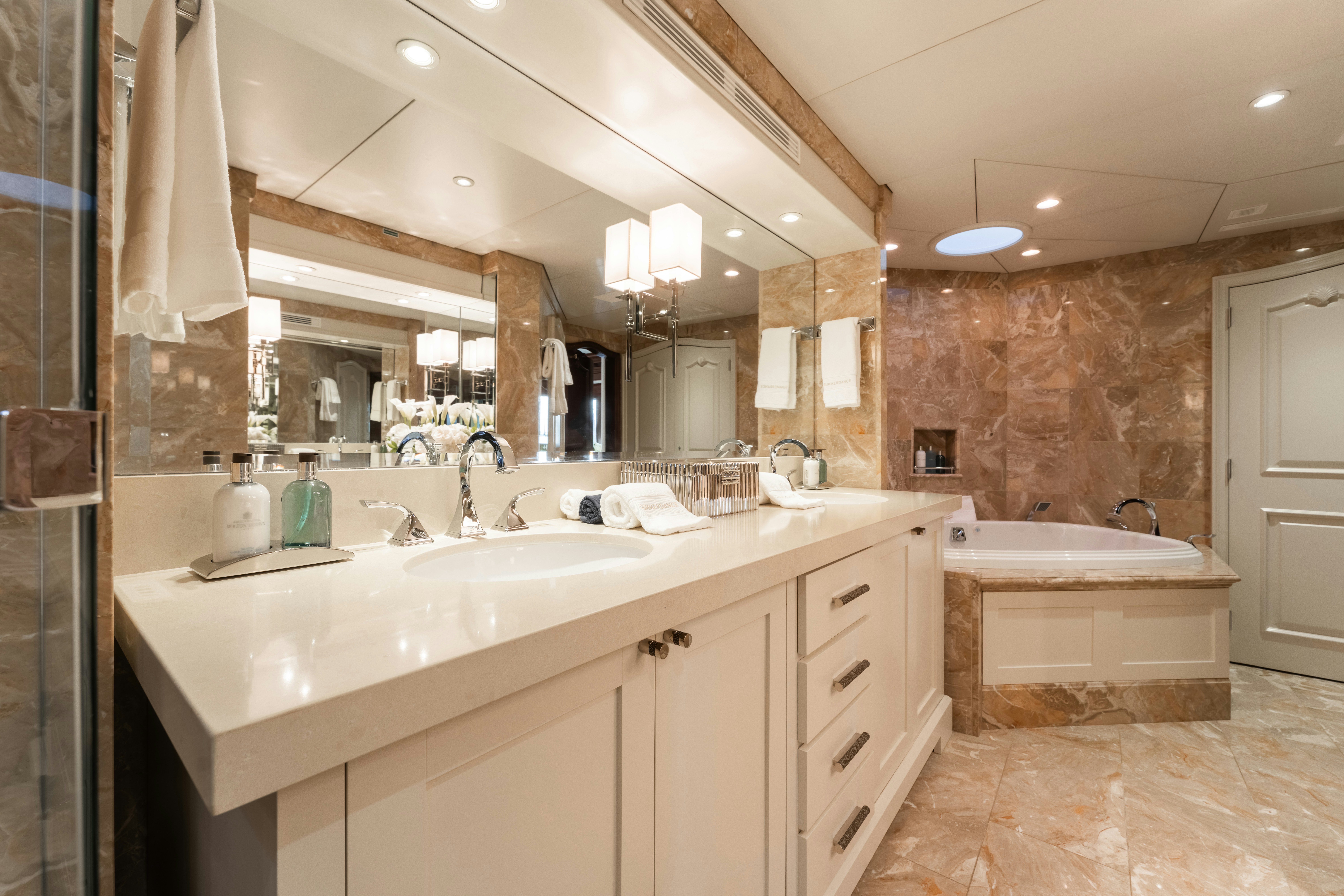 a bathroom with a large mirror aboard SUMMERDANCE Yacht for Charter