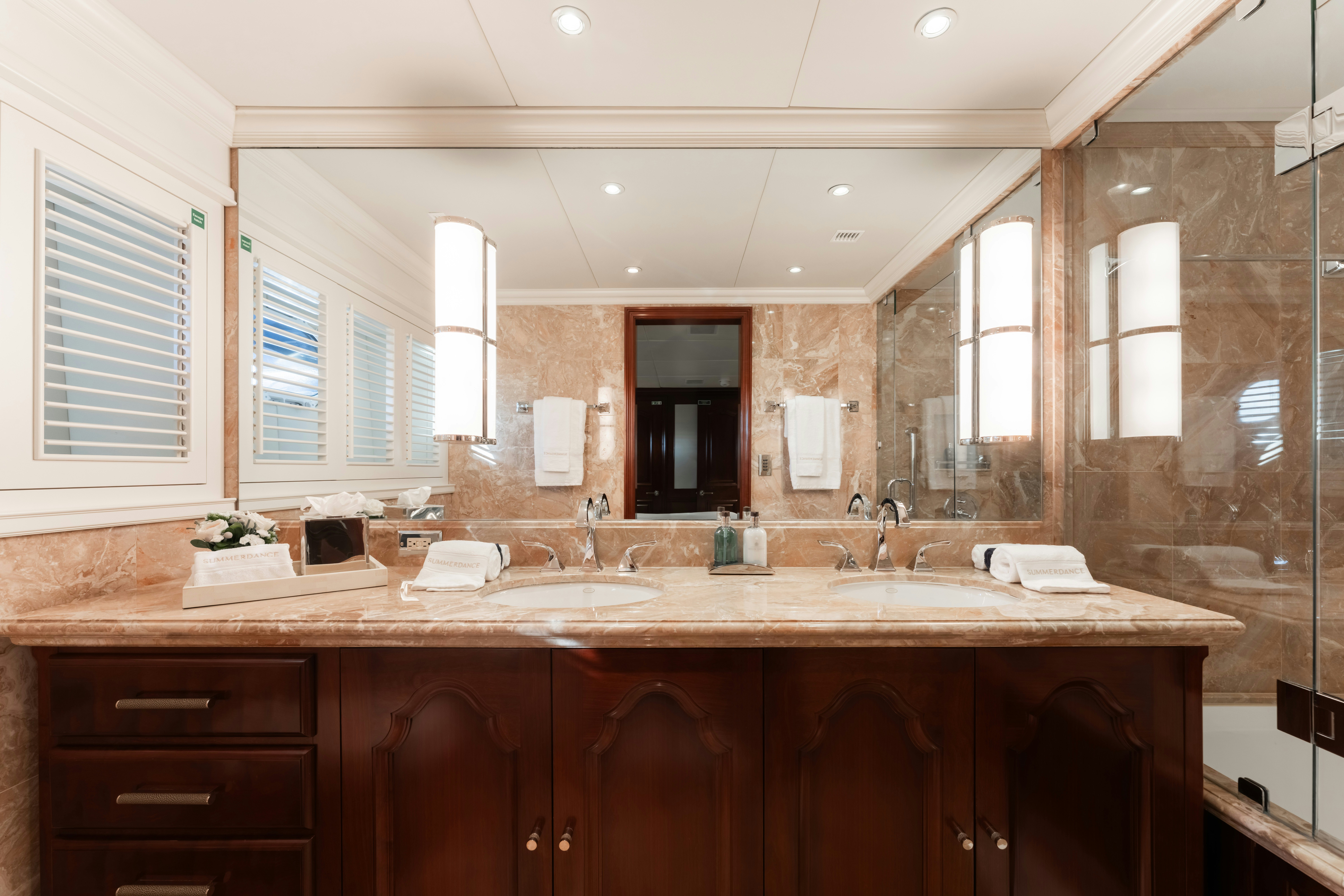 a bathroom with a sink and cabinets aboard SUMMERDANCE Yacht for Charter