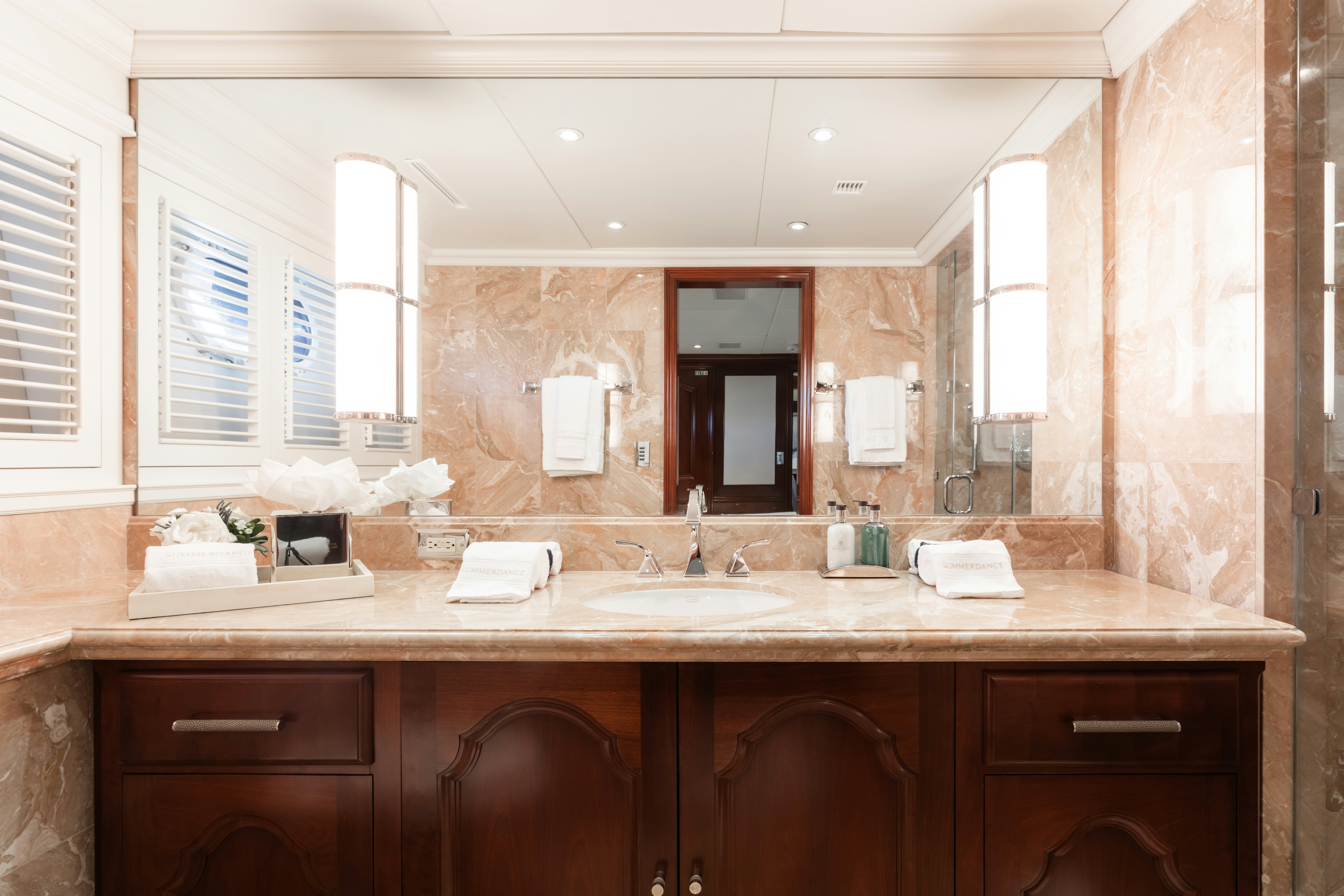 a bathroom with a sink and cabinets aboard SUMMERDANCE Yacht for Charter