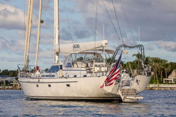 a large white boat in the water aboard SORCERER II Yacht for Sale