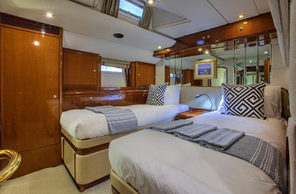 a room with two beds aboard SORCERER II Yacht for Sale