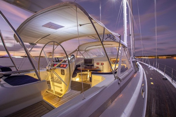 a large white boat with a yellow front aboard SORCERER II Yacht for Sale