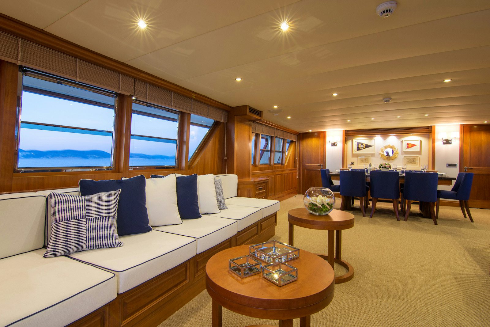 a living room with a couch and a table aboard PARVATI Yacht for Sale