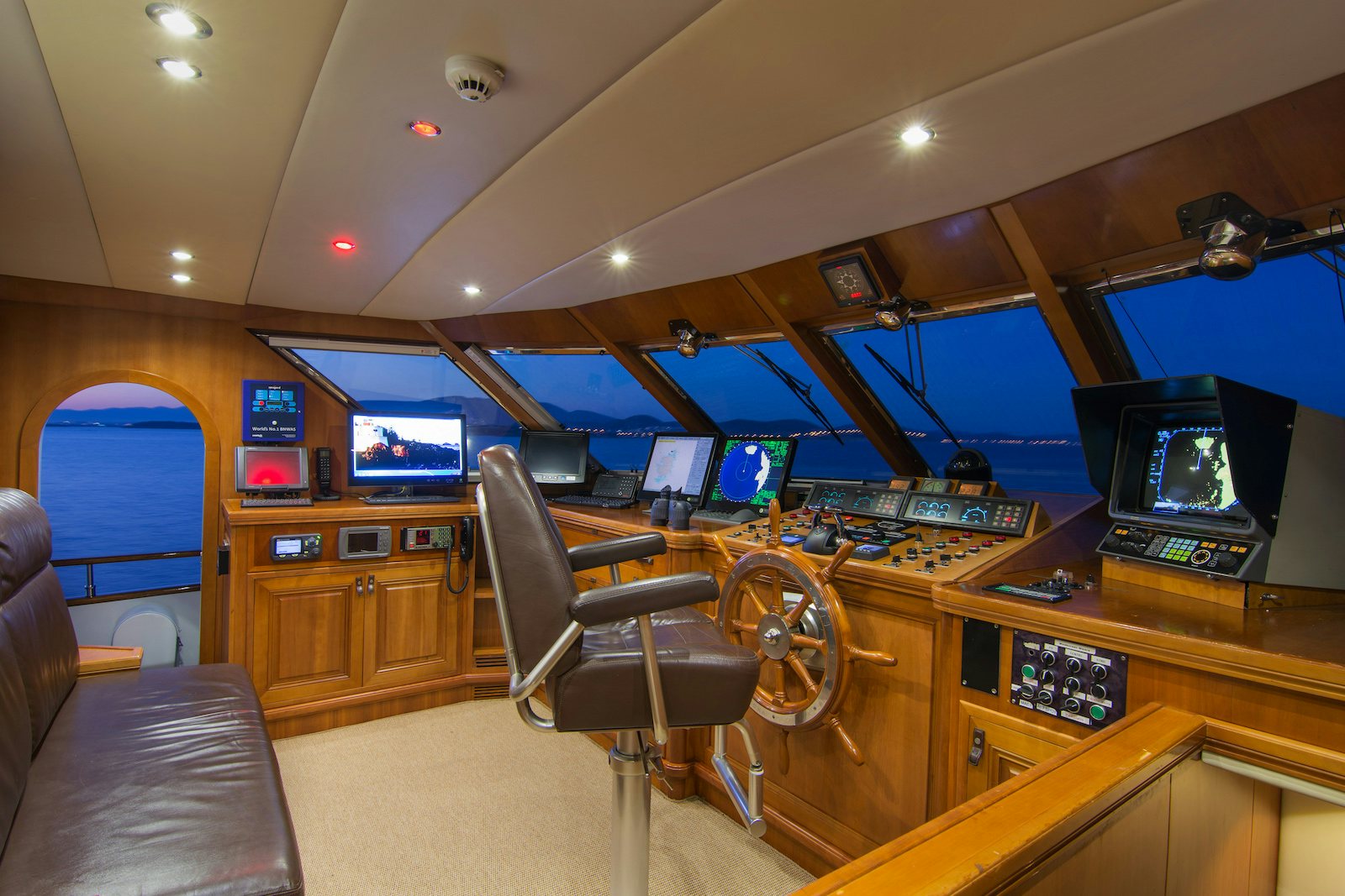 a room with a desk and chairs aboard PARVATI Yacht for Sale