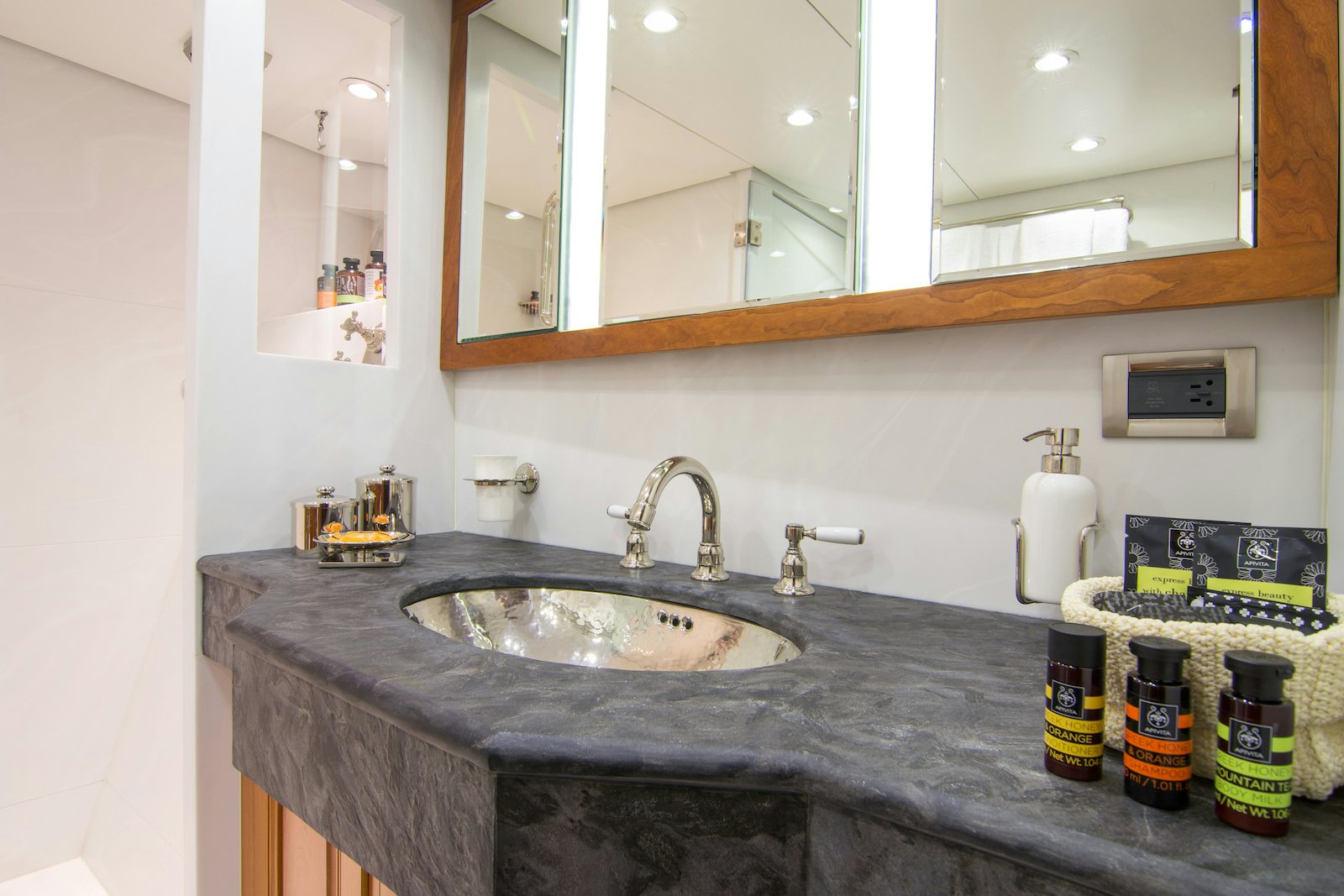 a bathroom sink with a mirror above it aboard PARVATI Yacht for Sale