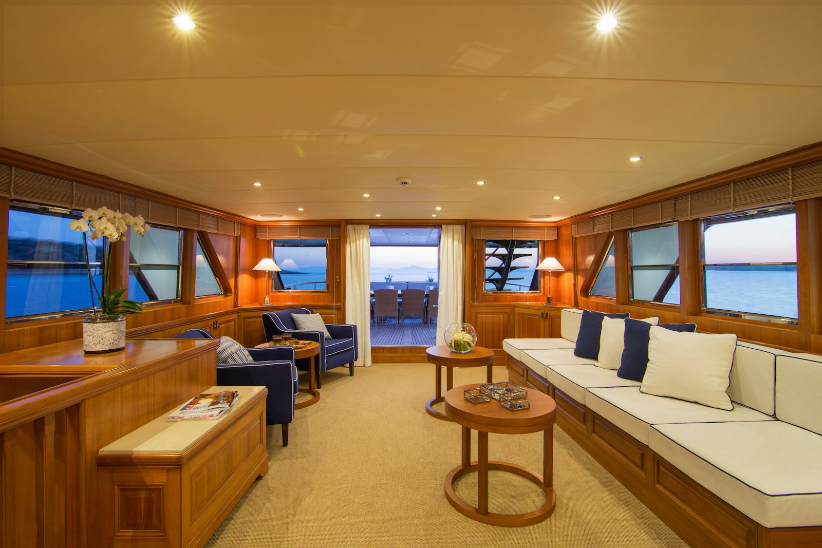 a living room with a large window aboard PARVATI Yacht for Sale