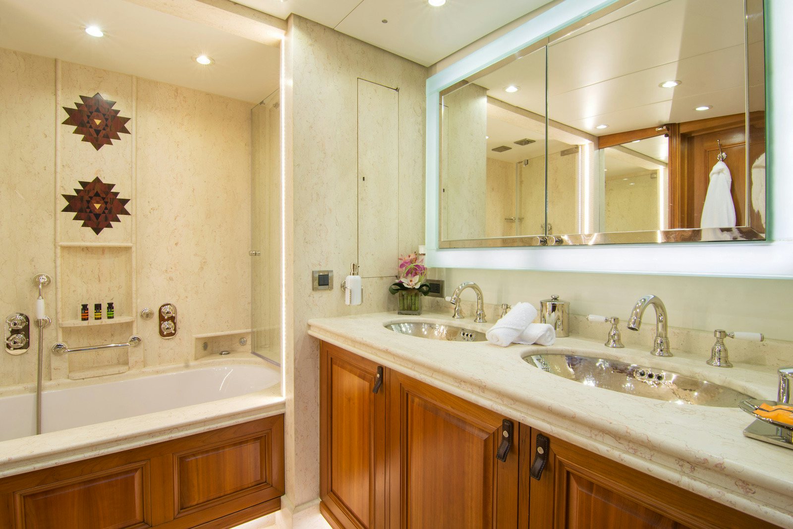a bathroom with a large mirror aboard PARVATI Yacht for Sale