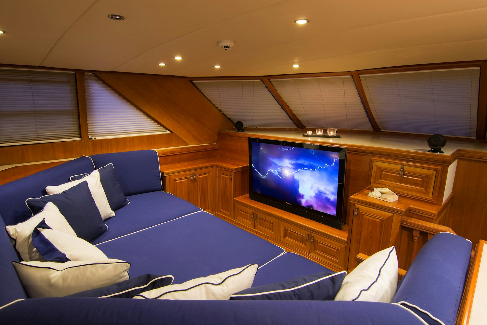 a room with a tv and a couch aboard PARVATI Yacht for Sale
