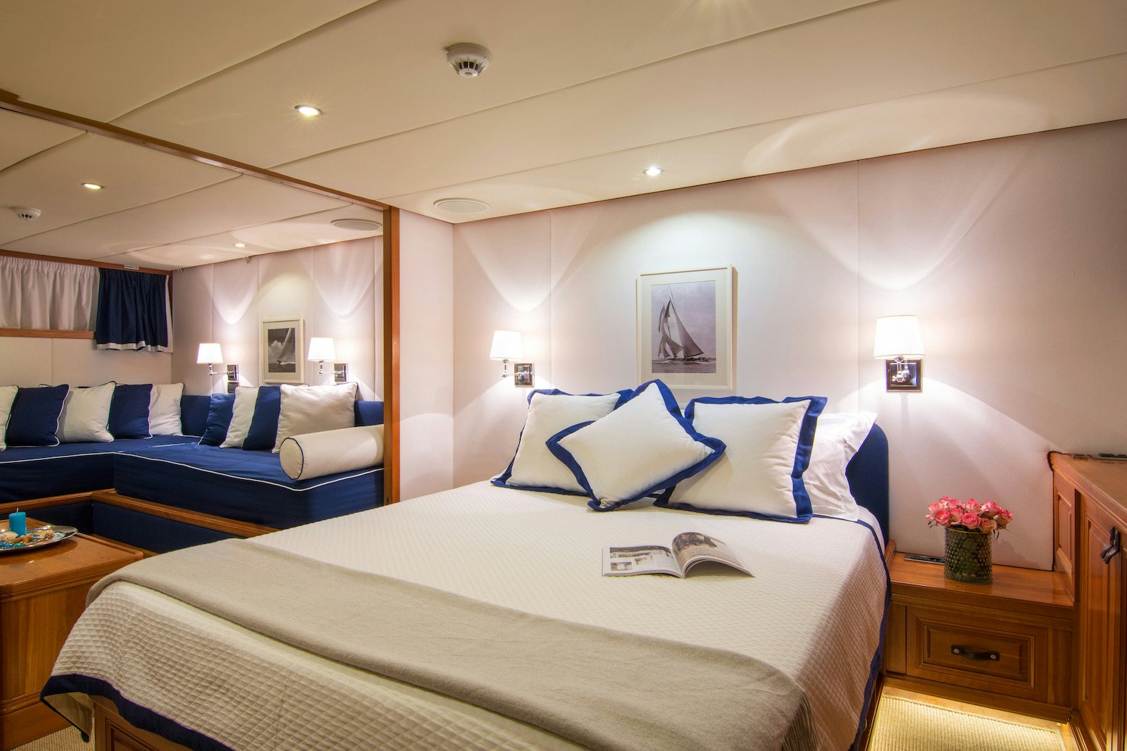 a bedroom with a bed and a desk aboard PARVATI Yacht for Sale