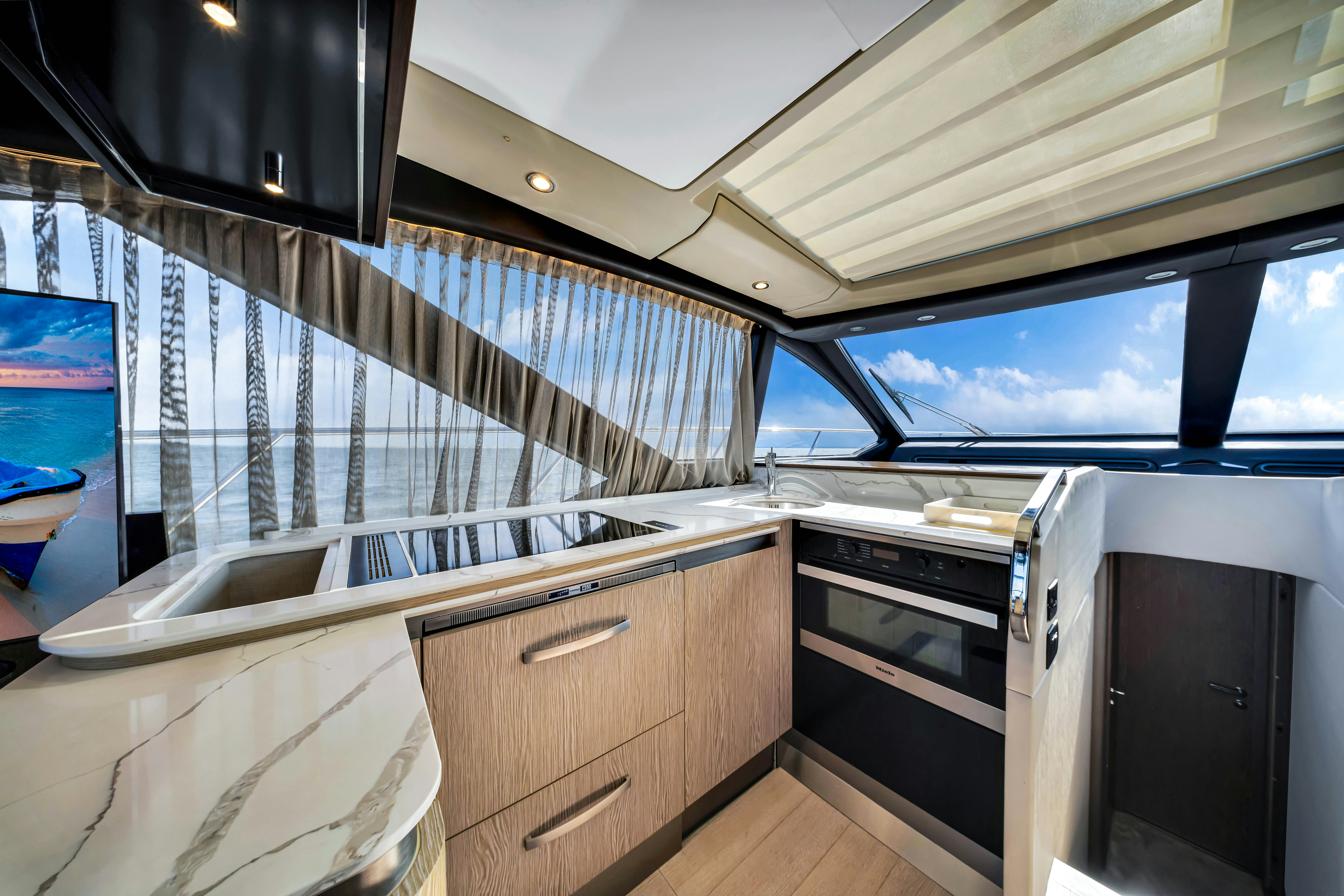 a room with a large window and a sink aboard AMF Yacht for Sale