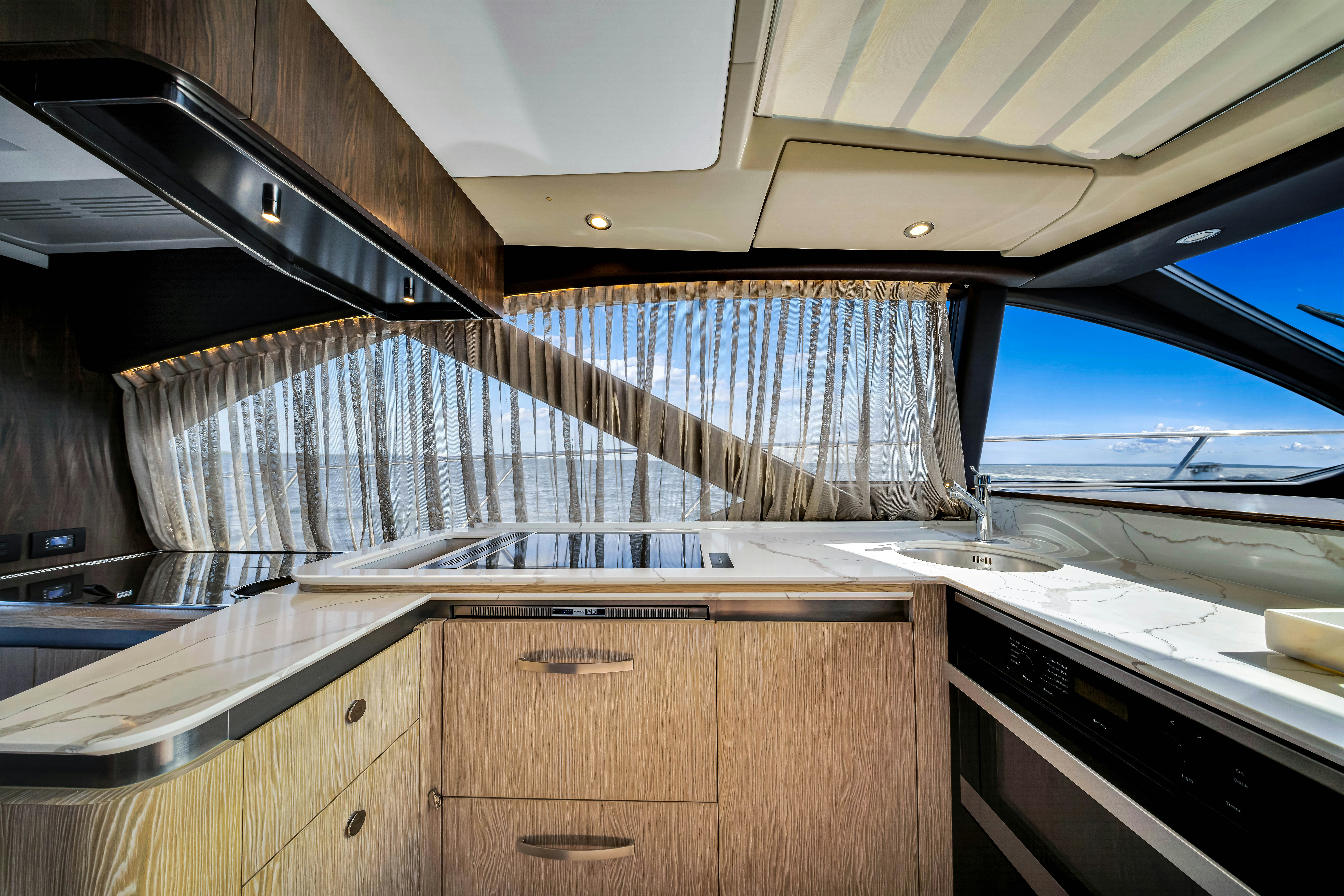 a kitchen with a large window aboard AMF Yacht for Sale