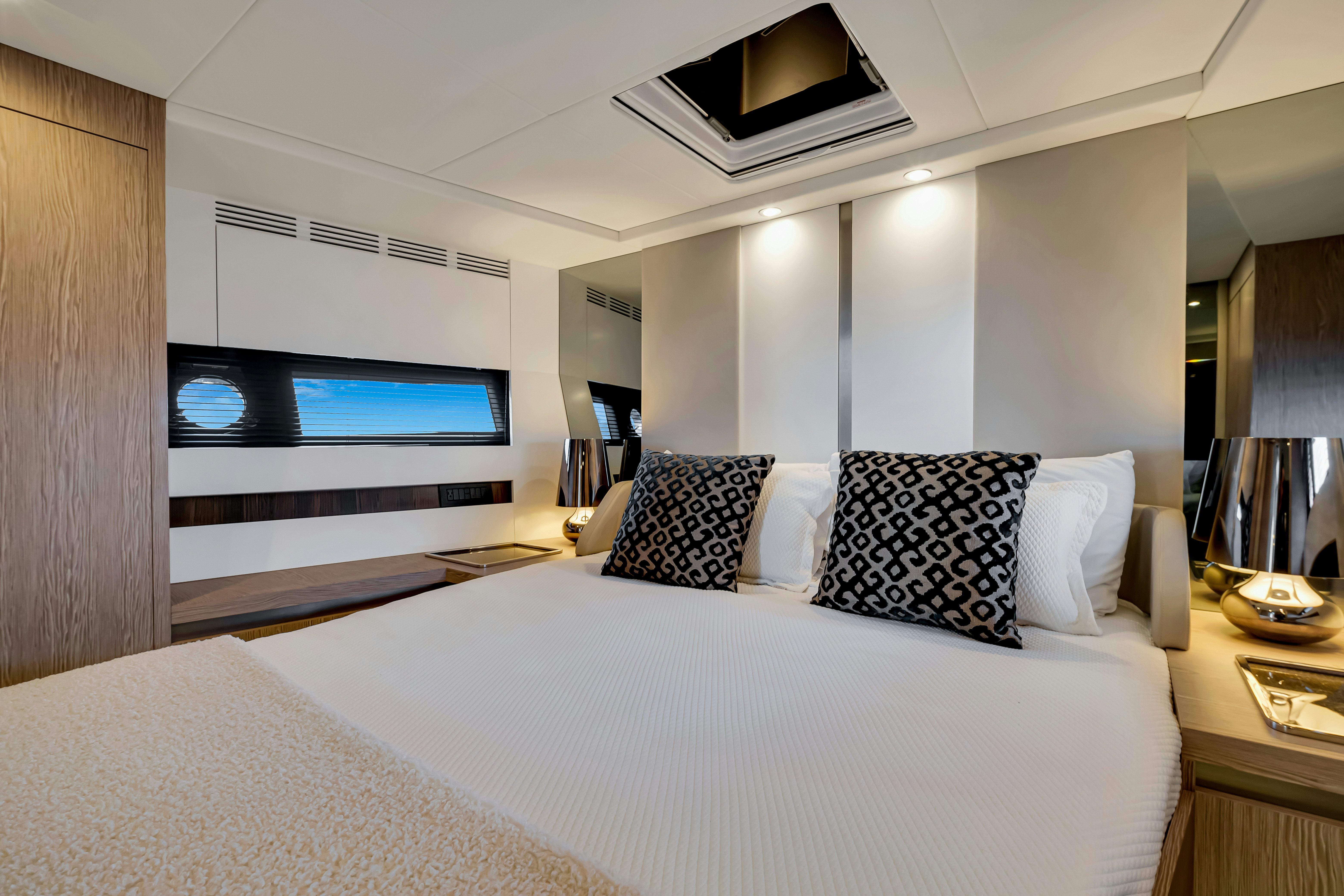 a hotel room with a large bed aboard AMF Yacht for Sale