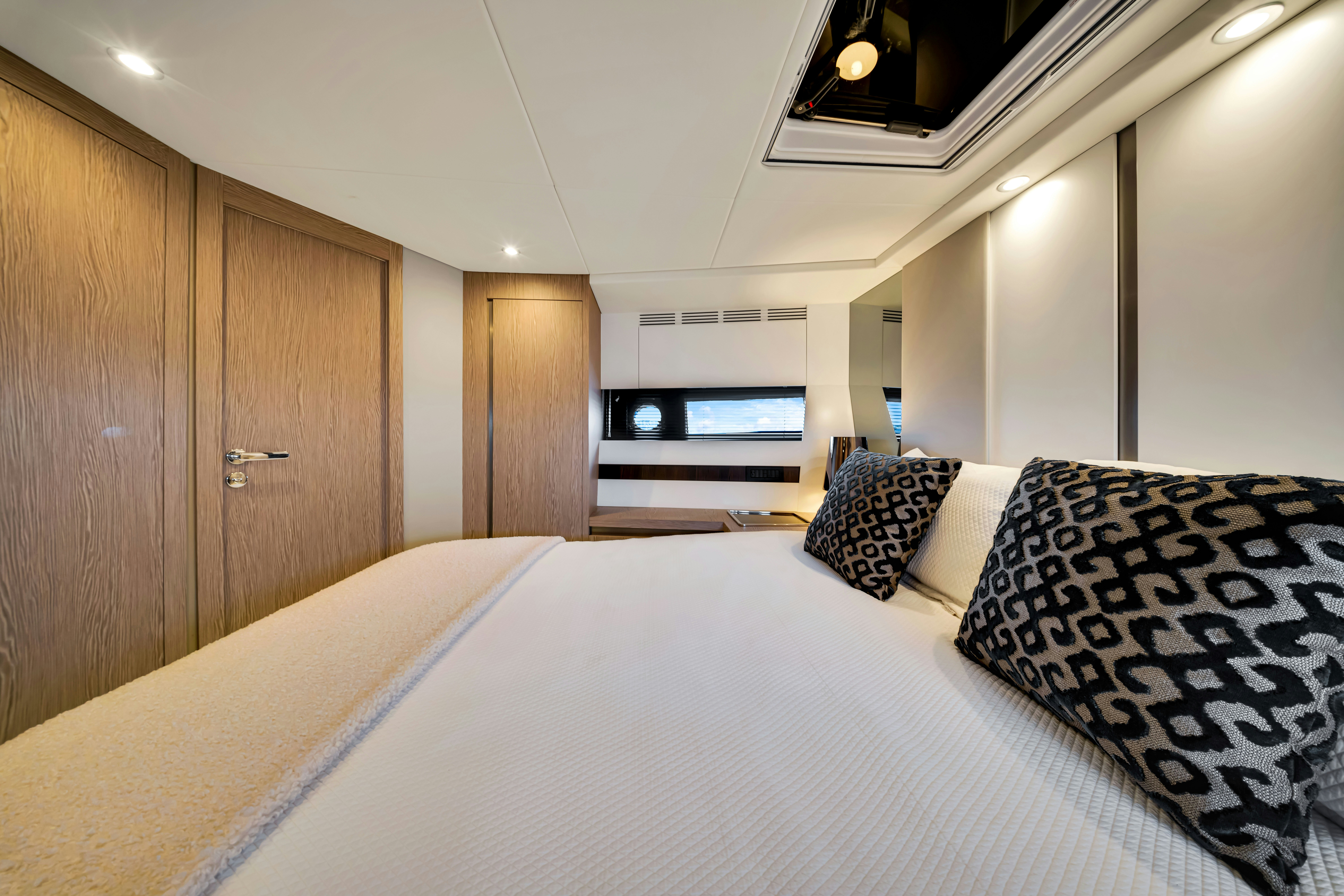 a bed with pillows aboard AMF Yacht for Sale
