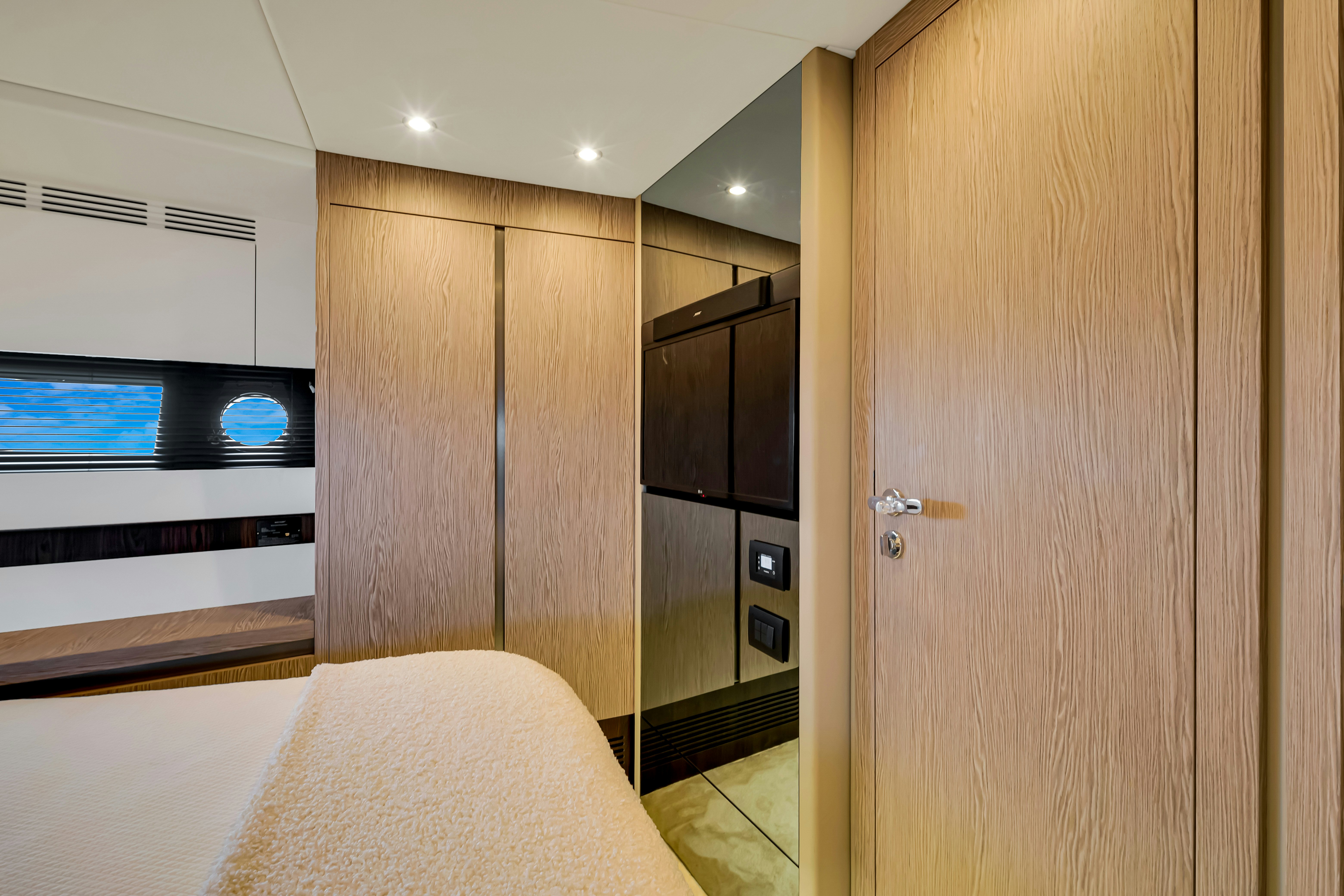 a bedroom with a closet and a bed aboard AMF Yacht for Sale
