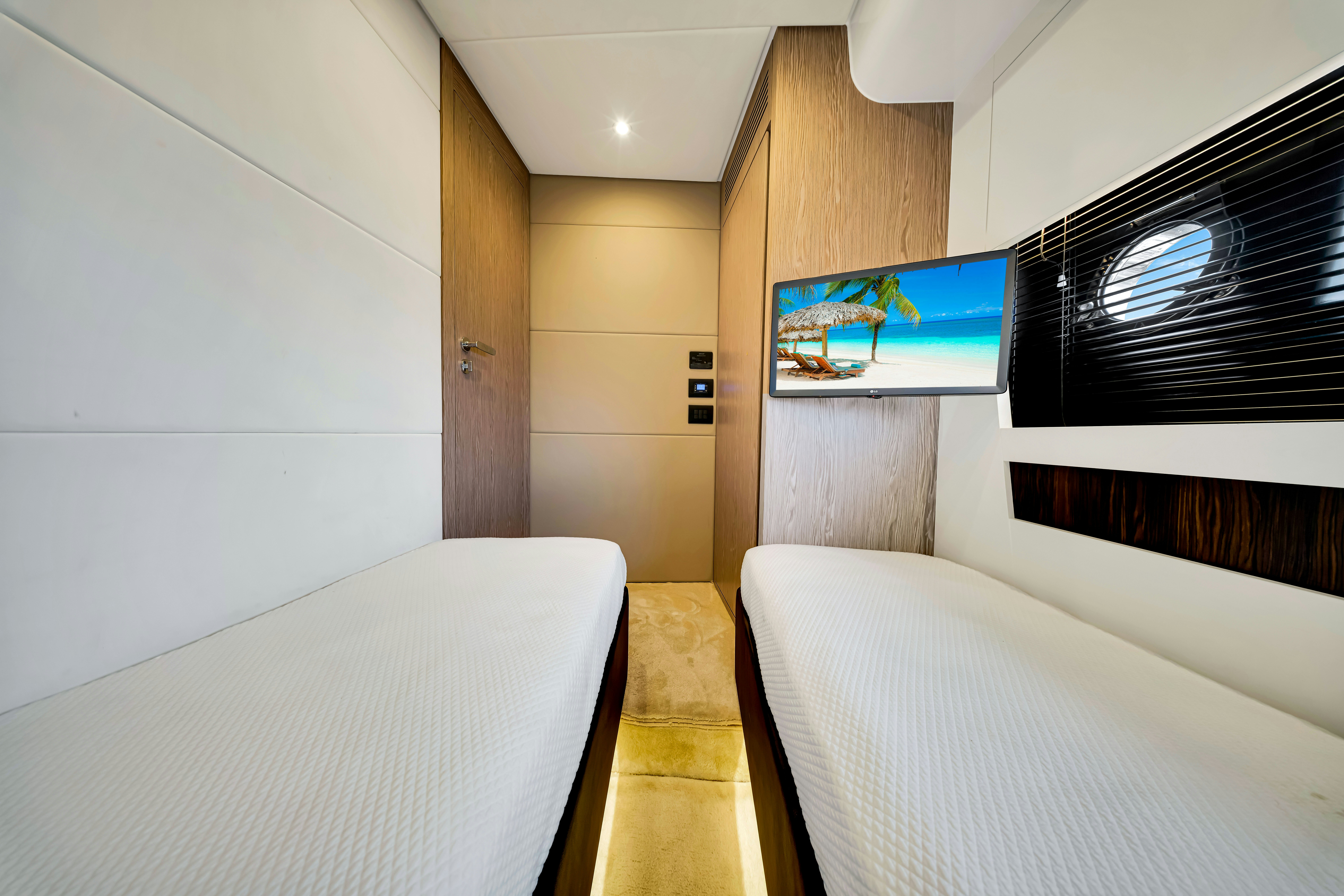 a room with a bed and a tv aboard AMF Yacht for Sale