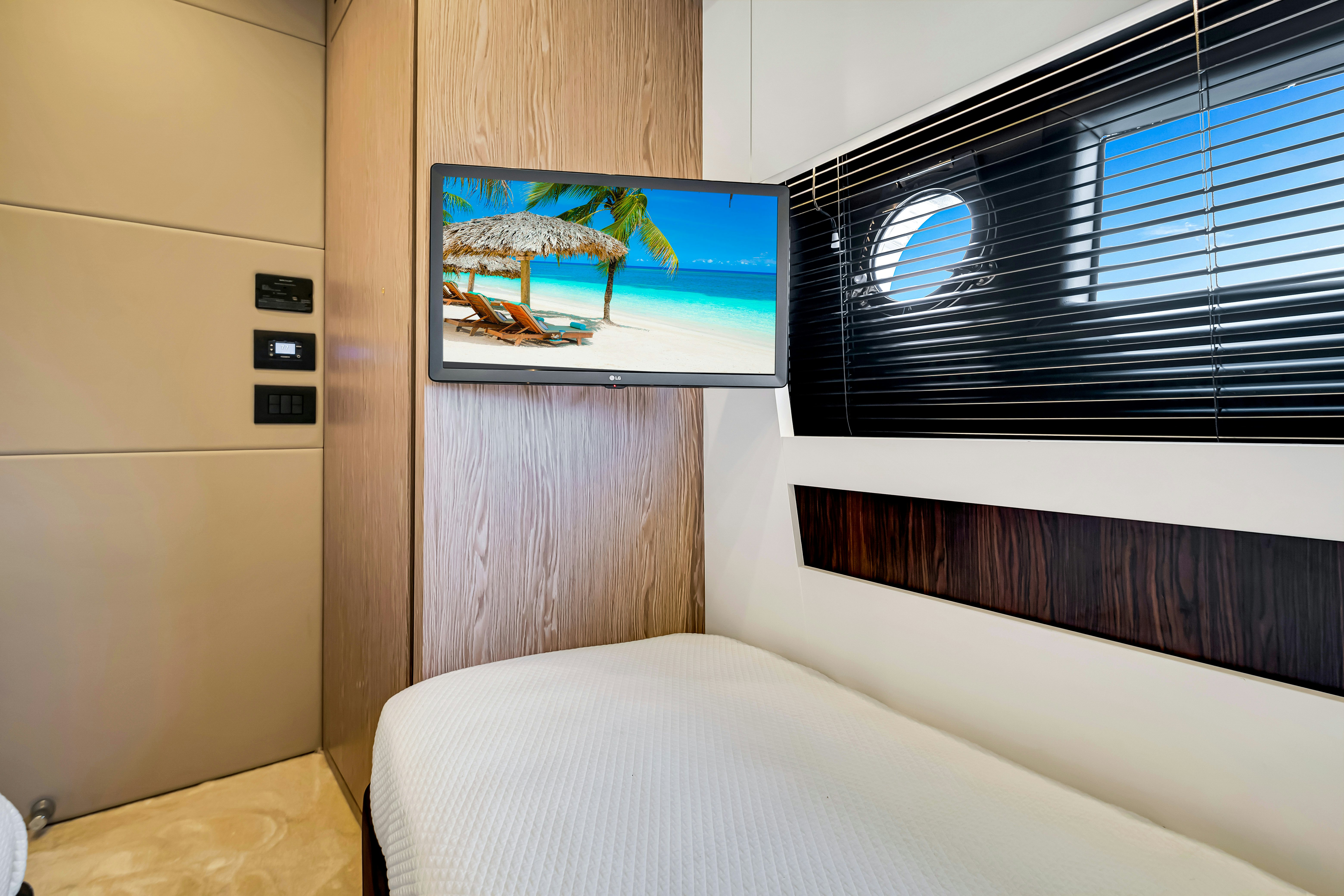 a bed with a picture on the wall aboard AMF Yacht for Sale