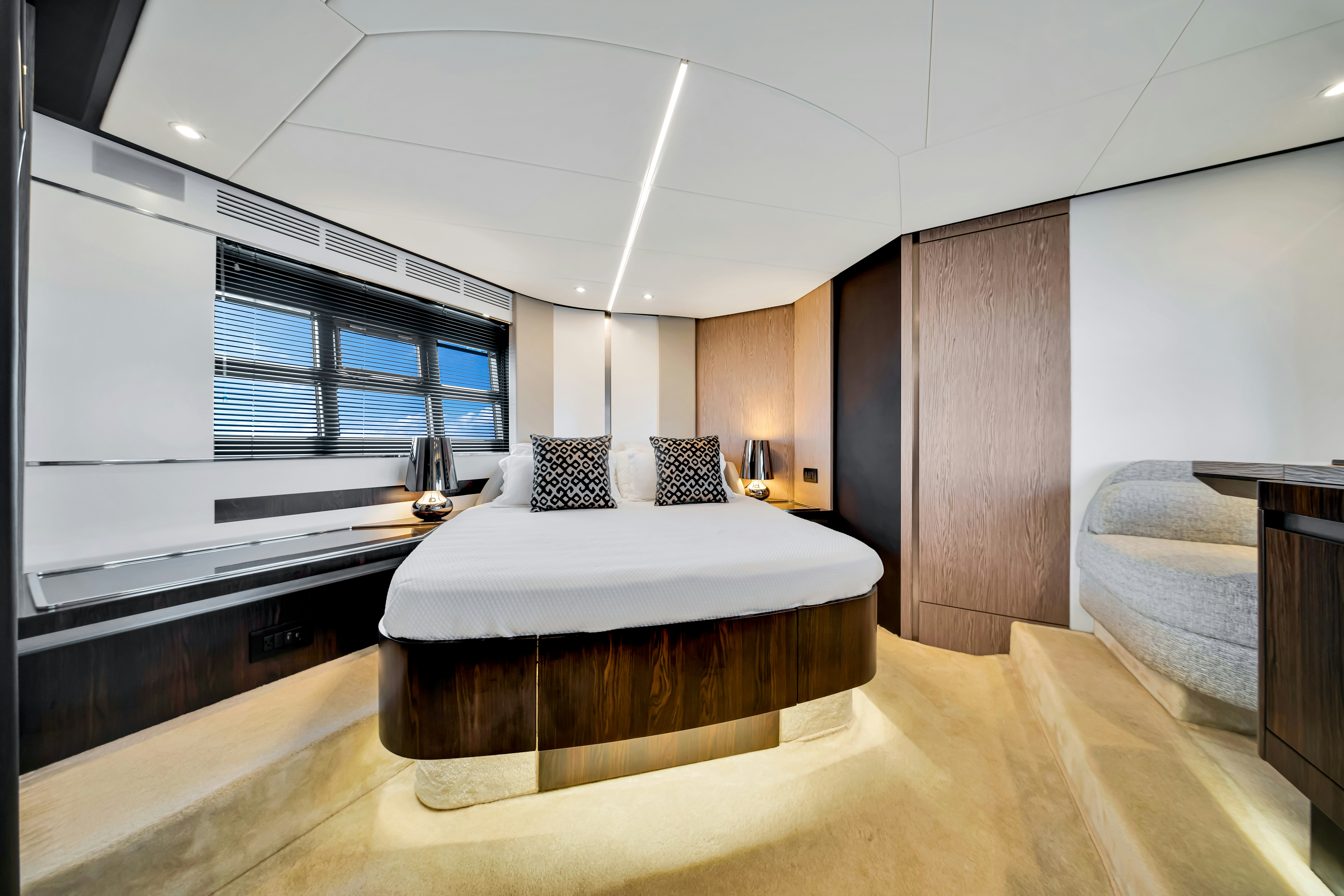 a large bedroom with a large bed aboard AMF Yacht for Sale