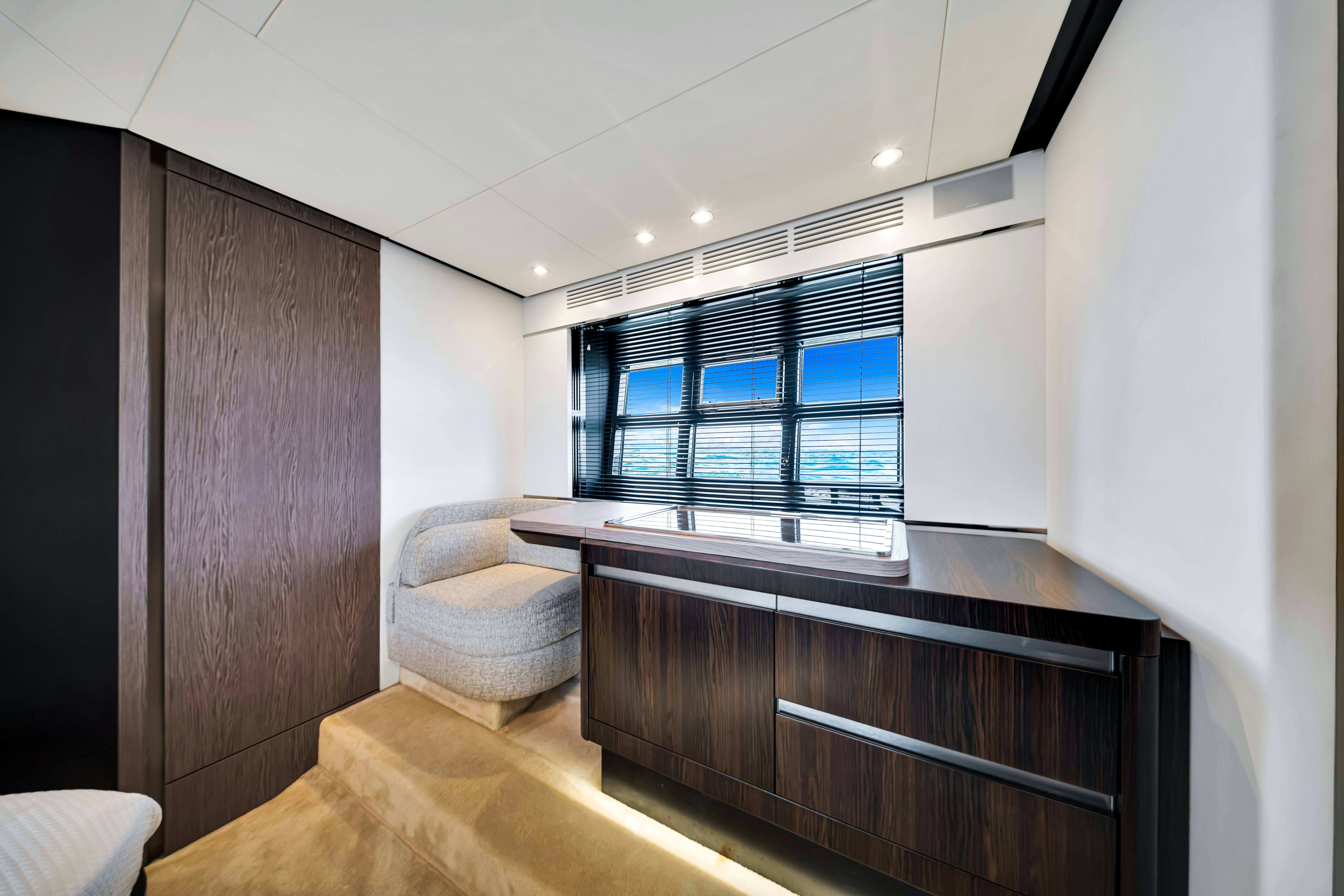 a room with a table and chairs aboard AMF Yacht for Sale