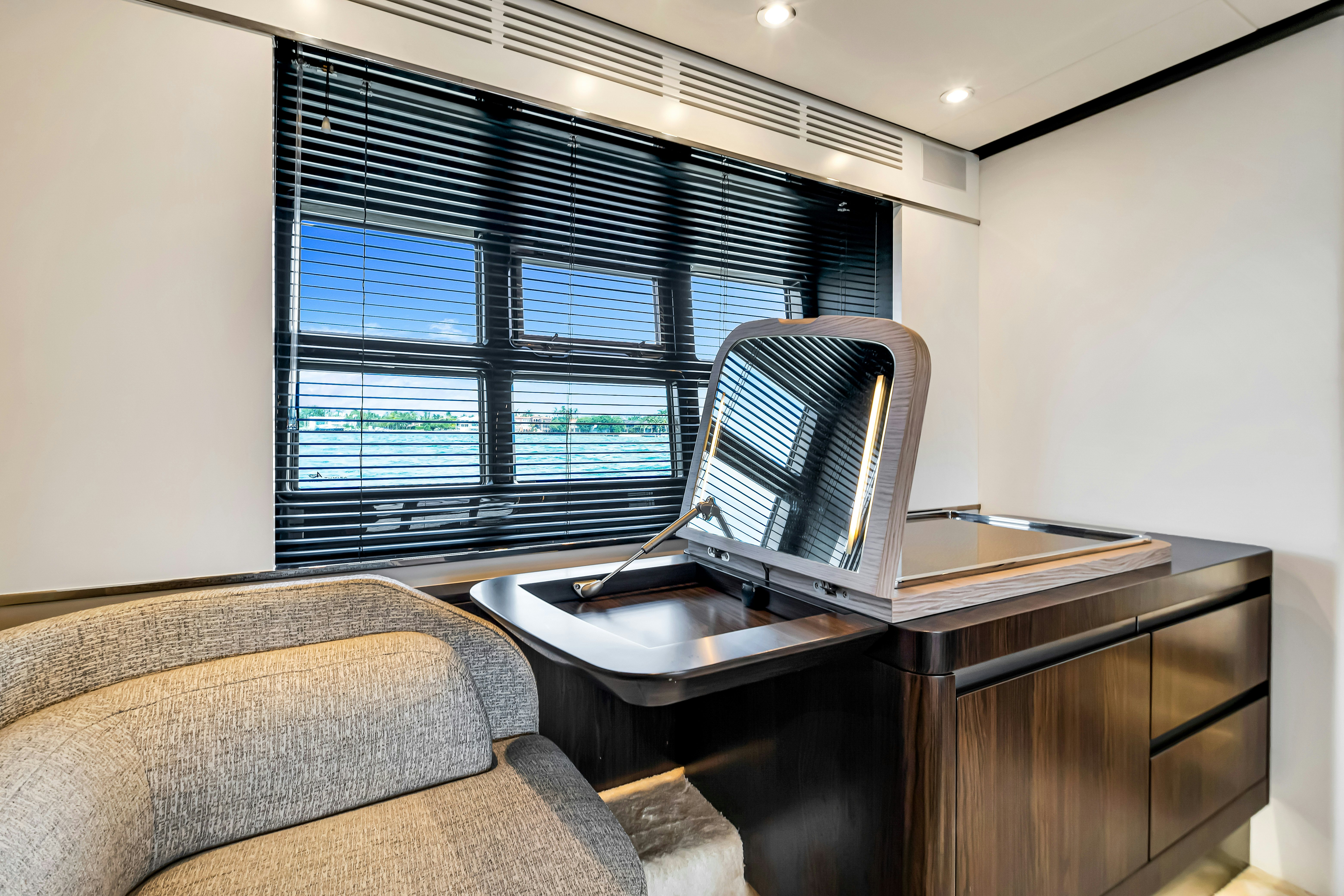 a laptop on a desk aboard AMF Yacht for Sale