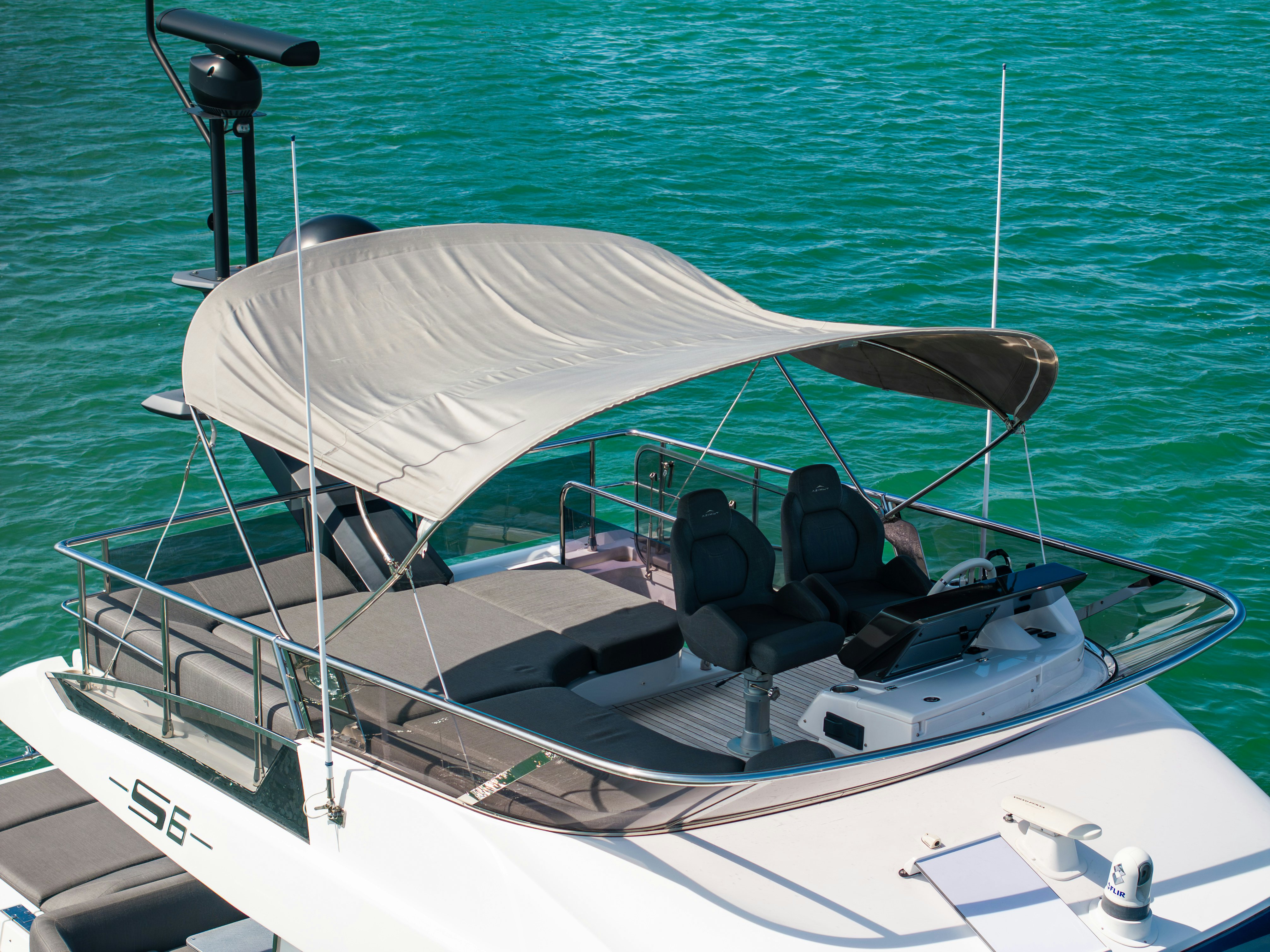 a white boat in the water aboard AMF Yacht for Sale