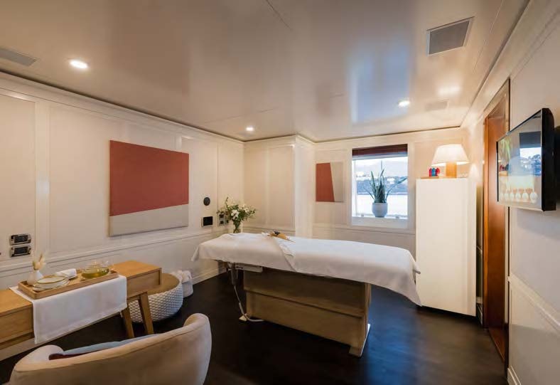 a room with a bed and a table aboard HBC Yacht for Sale