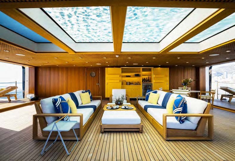 a room with a couch and a table aboard HBC Yacht for Sale