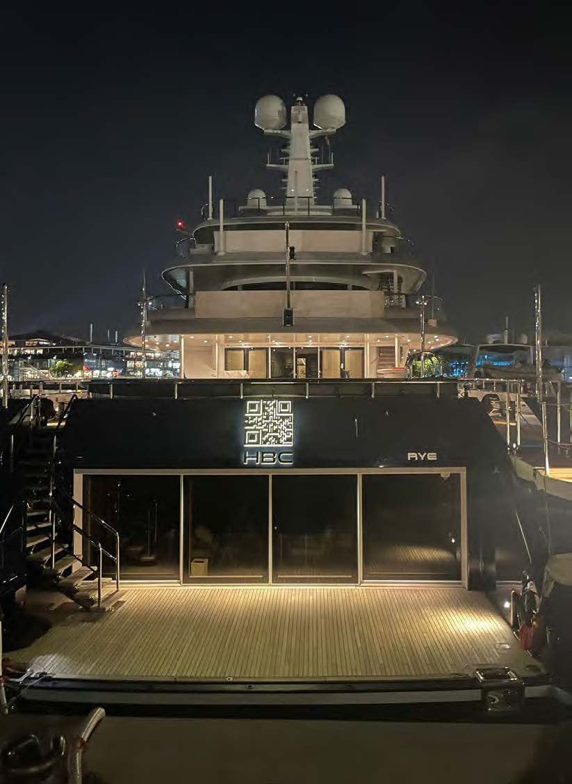 a large ship at night aboard HBC Yacht for Sale