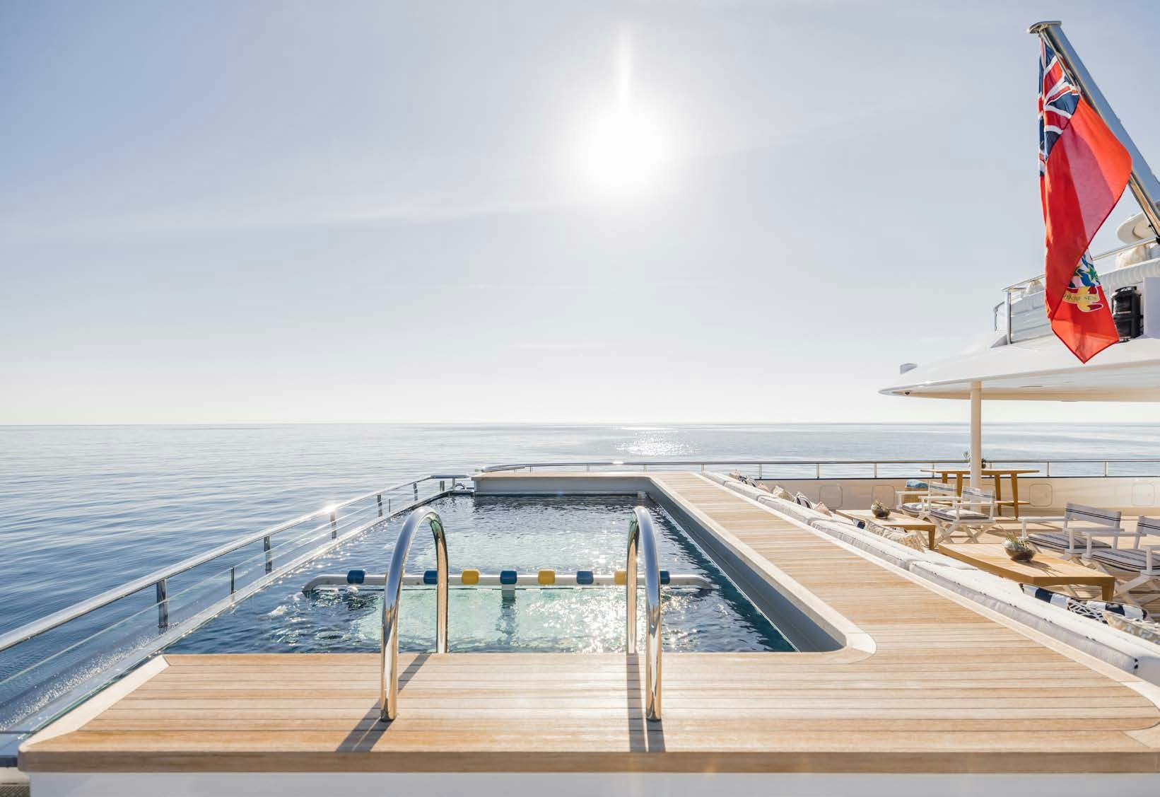 a deck with a flag on it aboard HBC Yacht for Sale