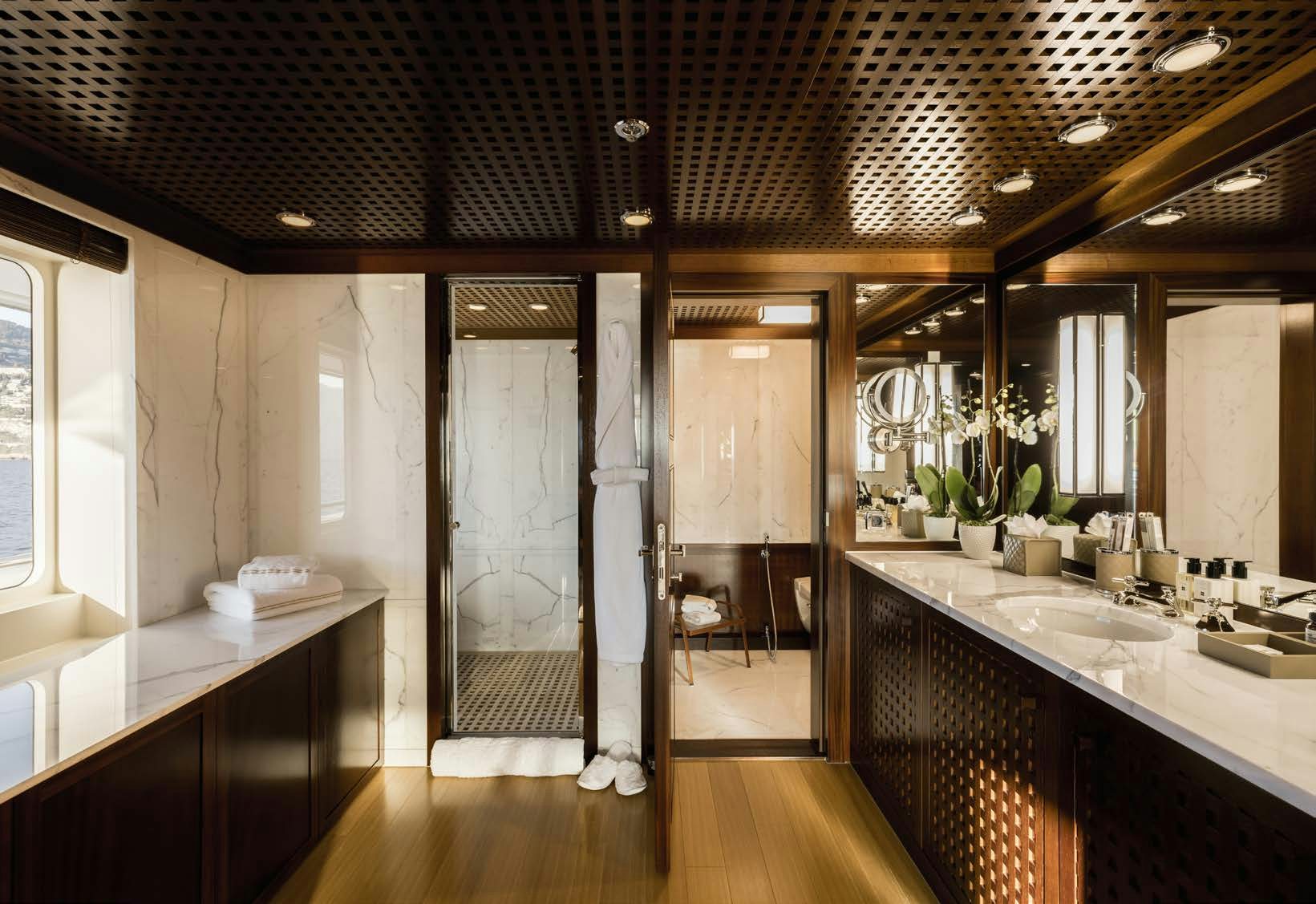 a bathroom with a large shower aboard HBC Yacht for Sale