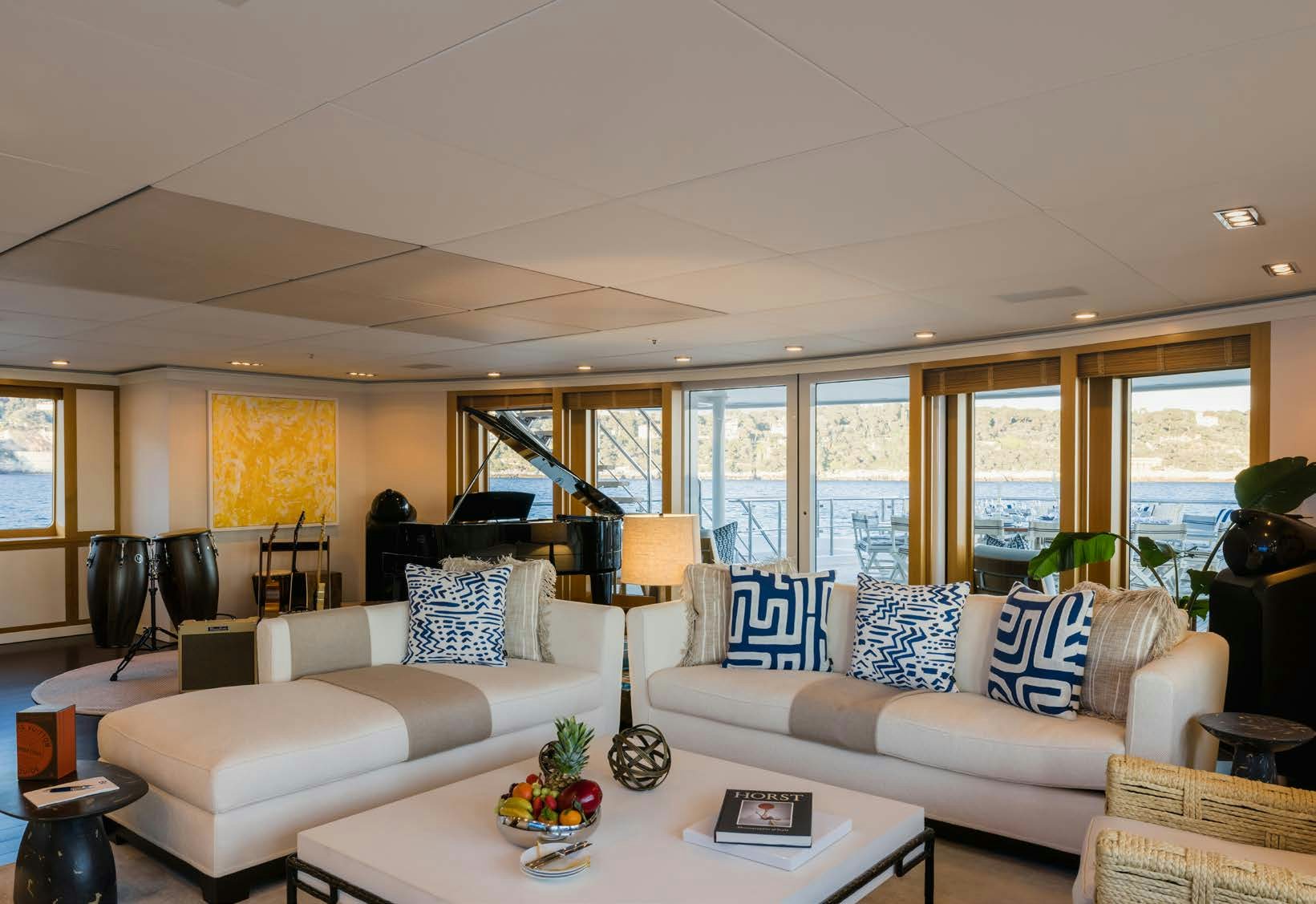 a living room with a large window aboard HBC Yacht for Sale