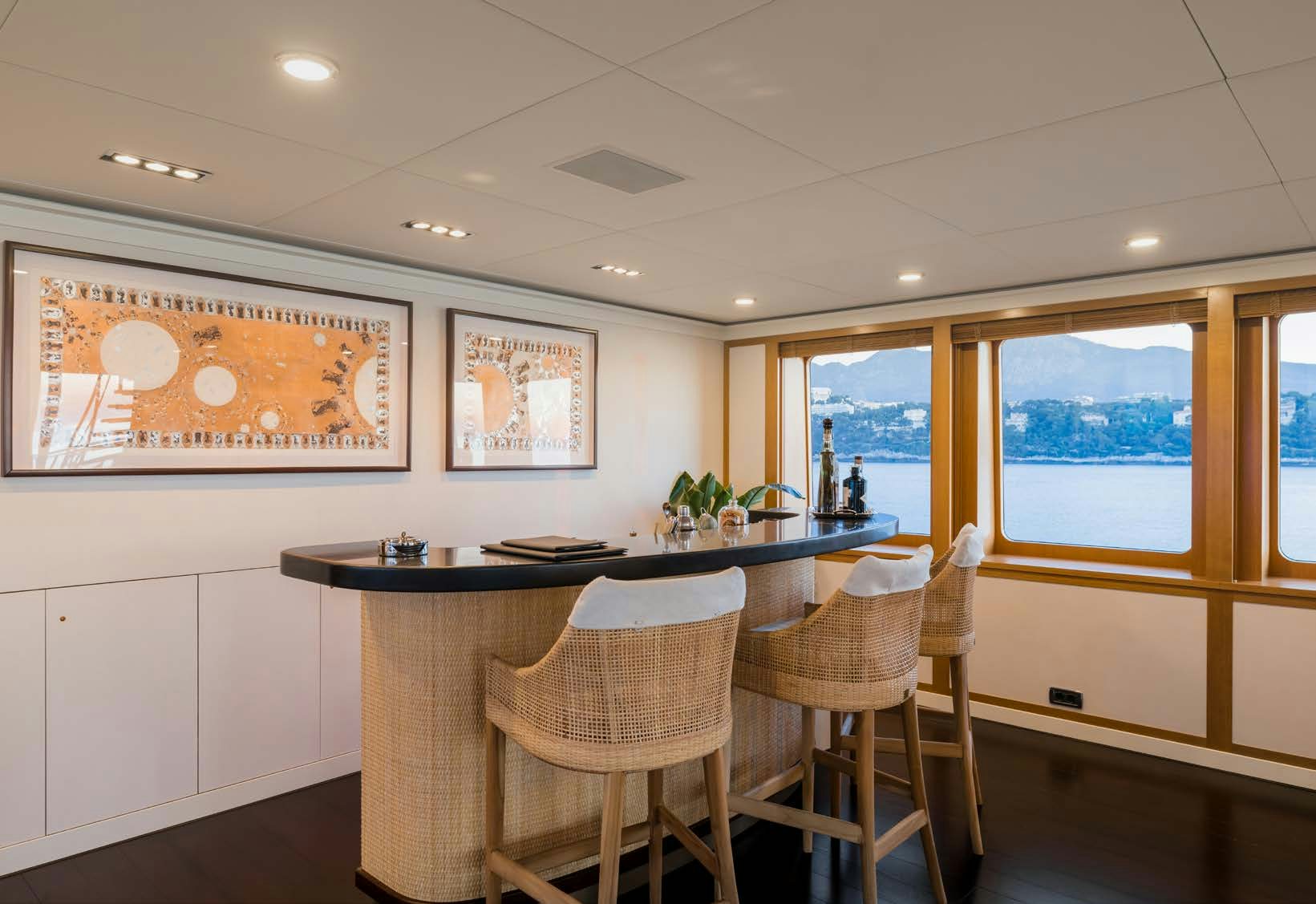 a kitchen with a table and chairs aboard HBC Yacht for Sale