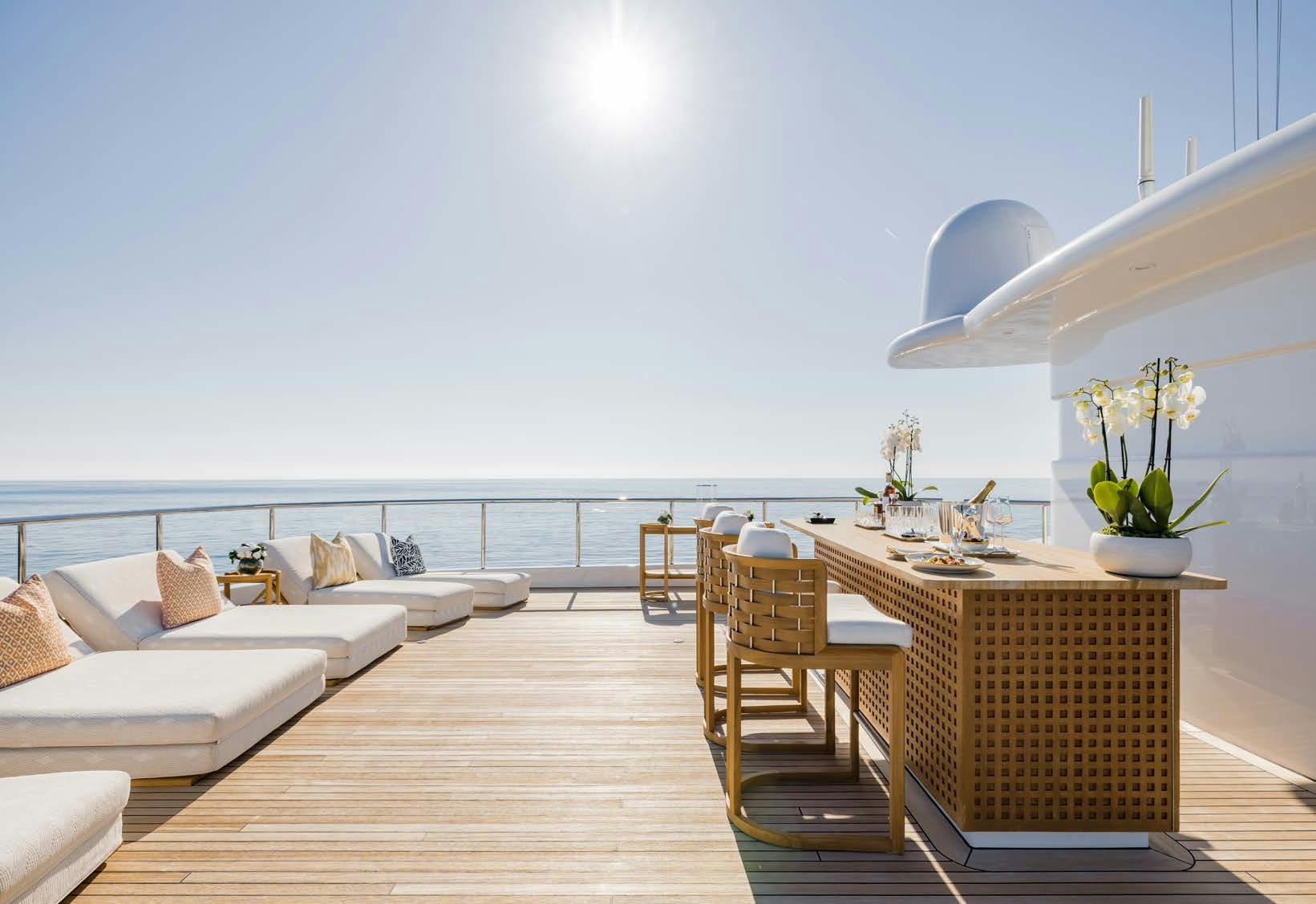 a room with a couch and a table and chairs aboard HBC Yacht for Sale