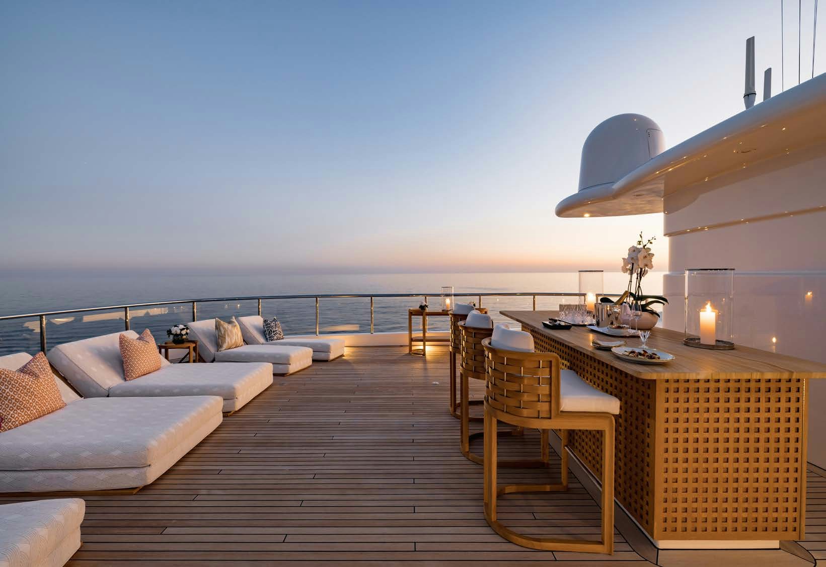 a large room with a couch and a table and chairs aboard HBC Yacht for Sale