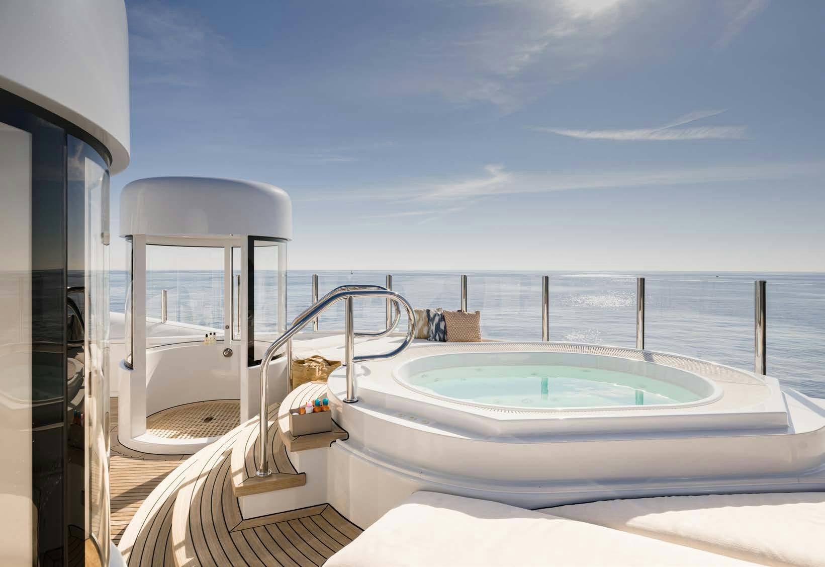 a bathtub with a sink and a mirror on the side aboard HBC Yacht for Sale