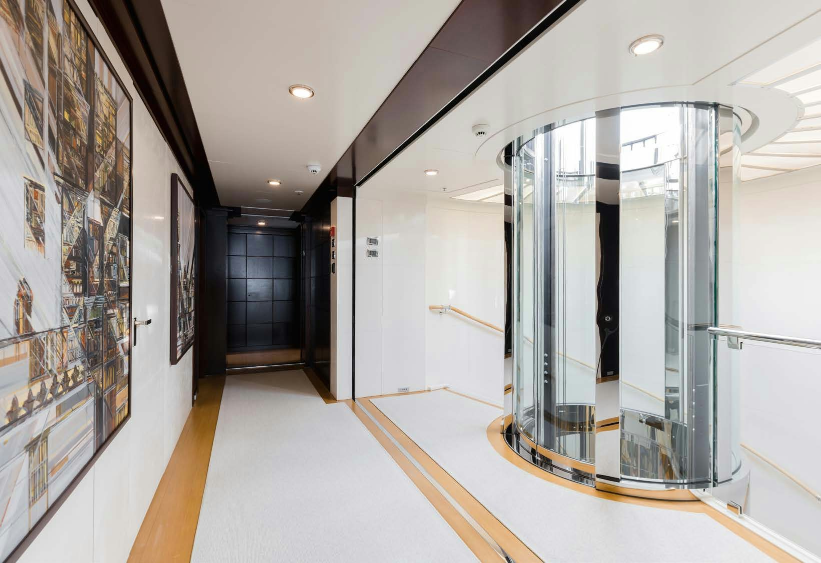 a large glass shower unit in a room with a glass wall aboard HBC Yacht for Sale