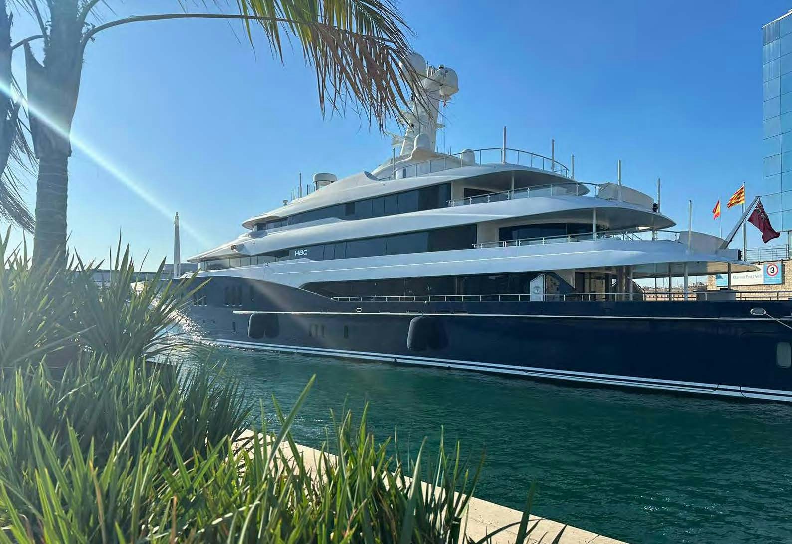 a large cruise ship docked aboard HBC Yacht for Sale