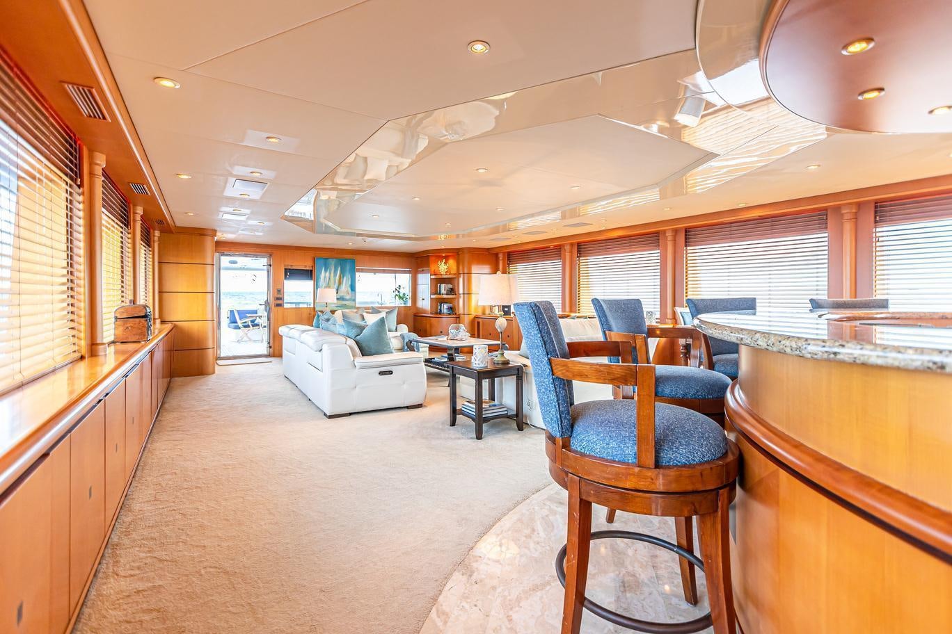 inside of a building with a couch and chairs aboard XOXO (118') Yacht for Charter