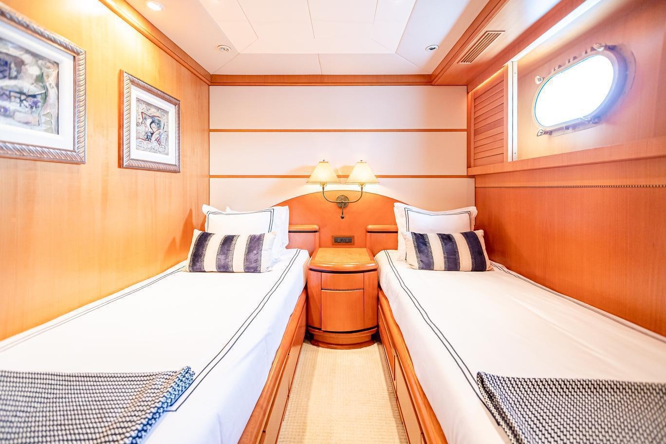 a room with two beds aboard XOXO (118') Yacht for Charter