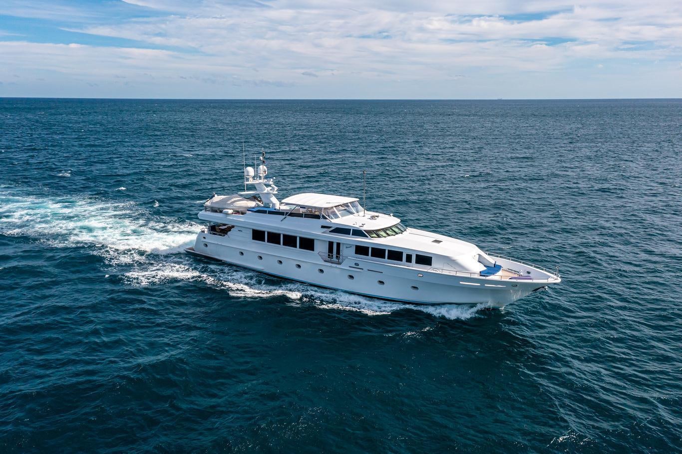 a white boat in the water aboard XOXO (118') Yacht for Charter