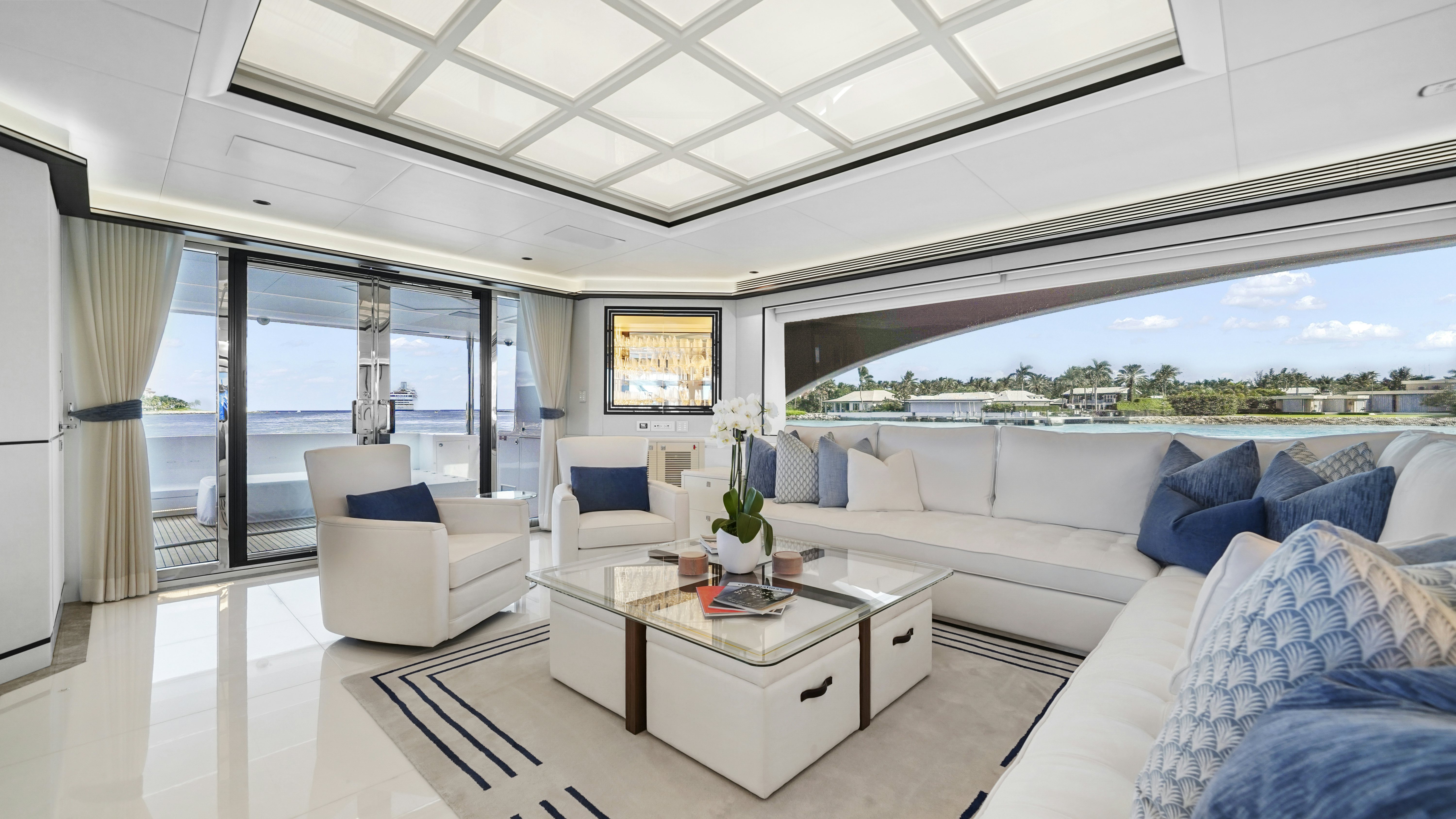 a living room with a large window aboard MISS MICHELLE Yacht for Sale