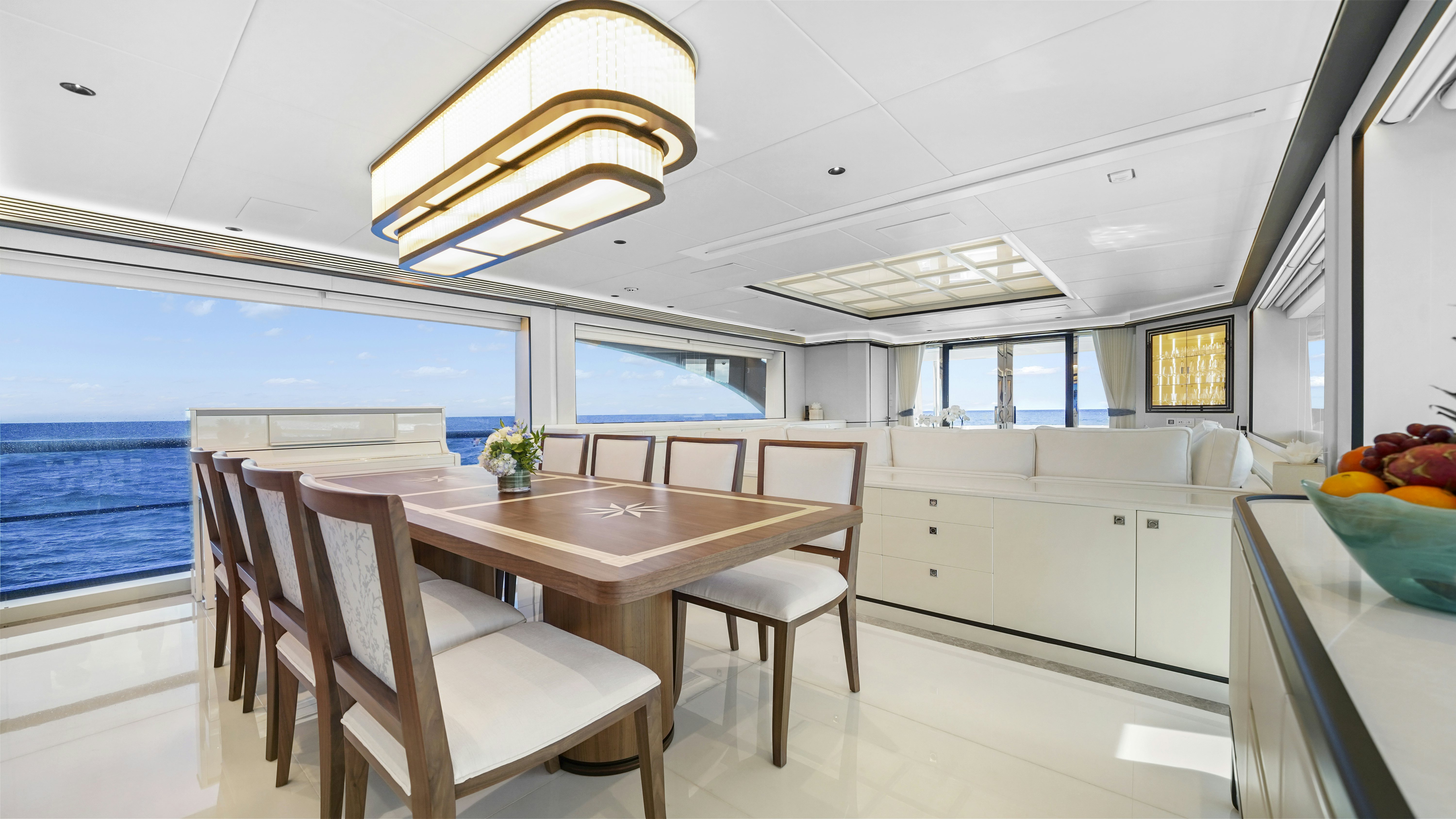 a kitchen with a table and chairs aboard MISS MICHELLE Yacht for Sale