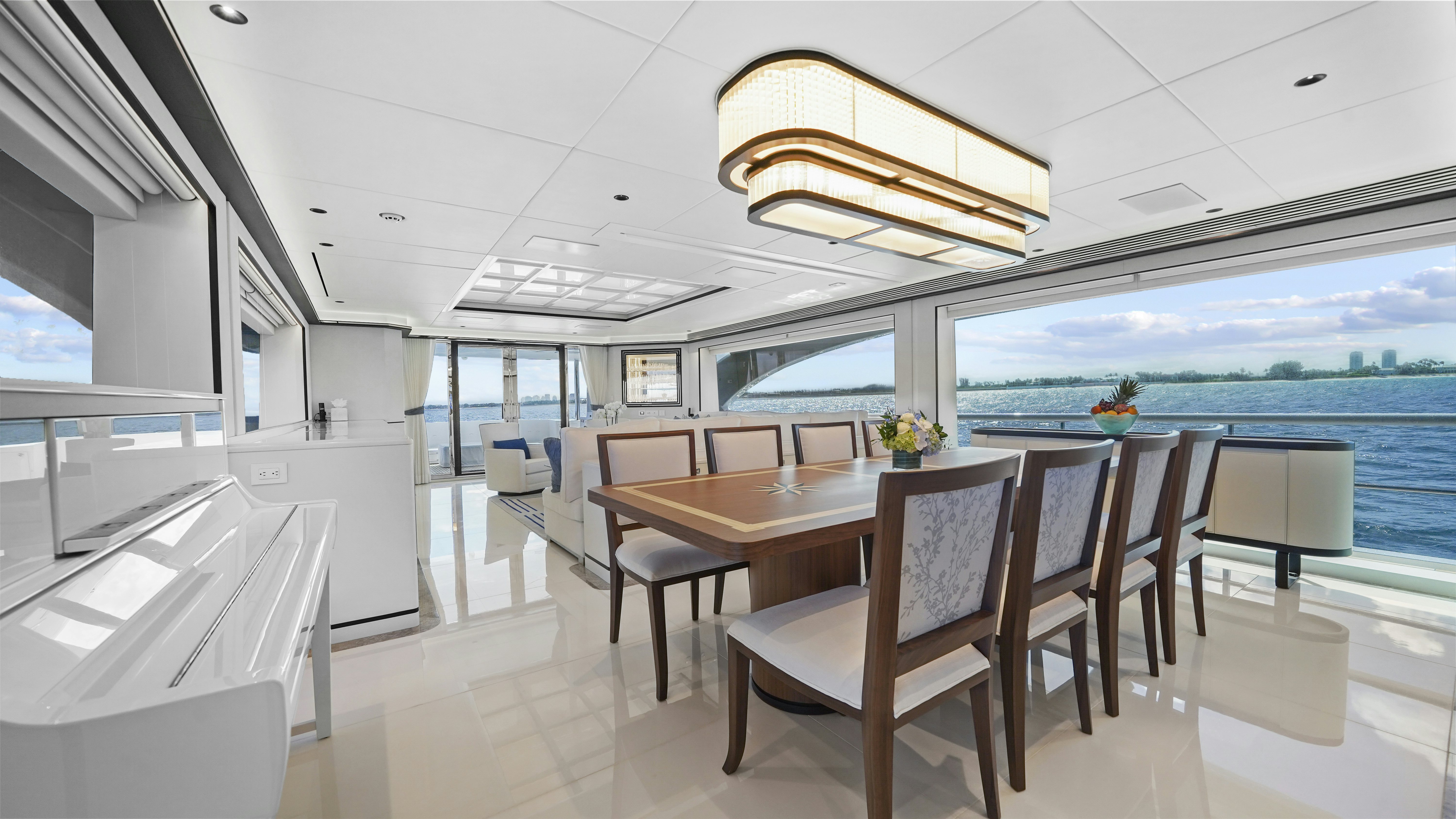 a room with a table and chairs aboard MISS MICHELLE Yacht for Sale