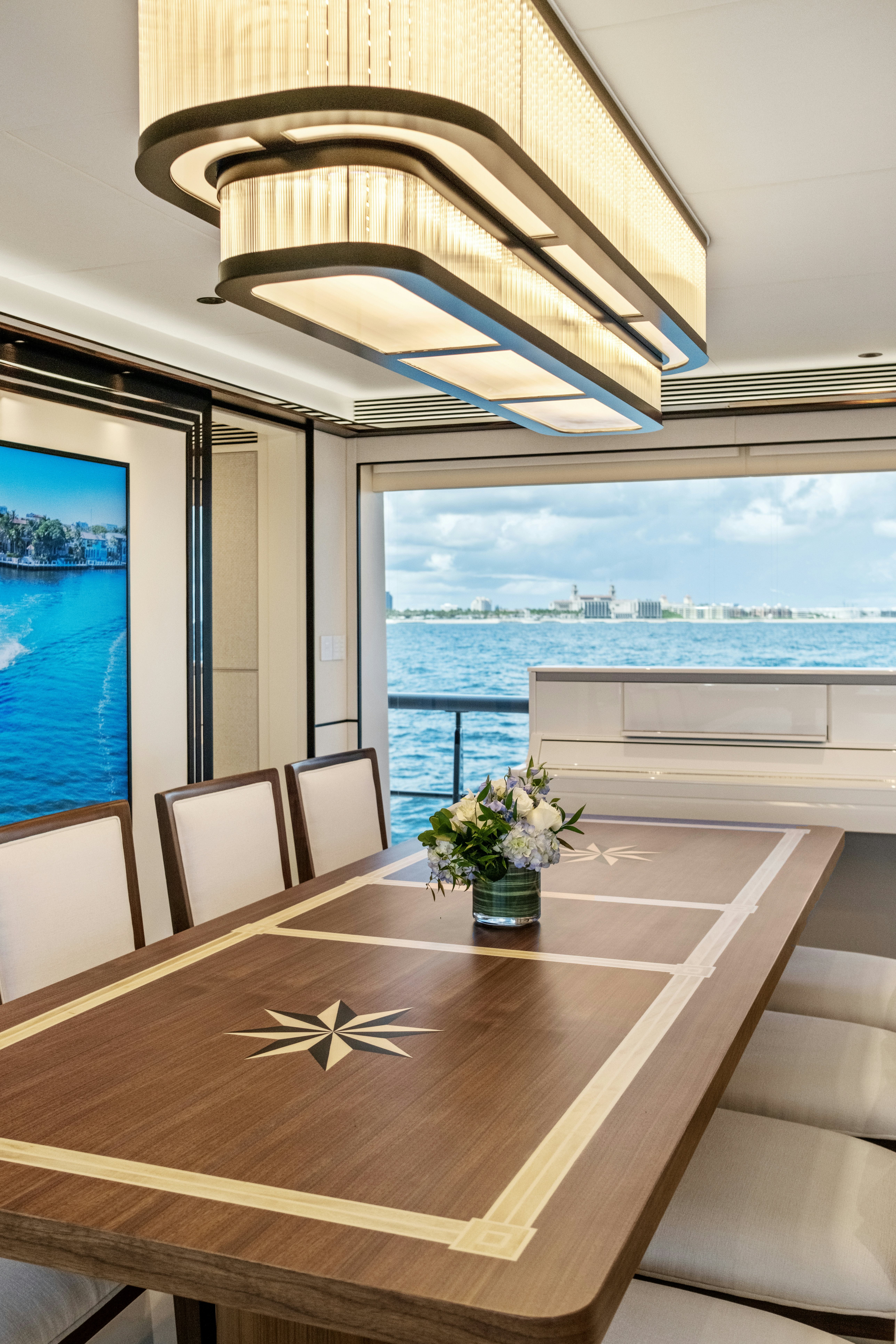 a room with a table and chairs aboard MISS MICHELLE Yacht for Sale