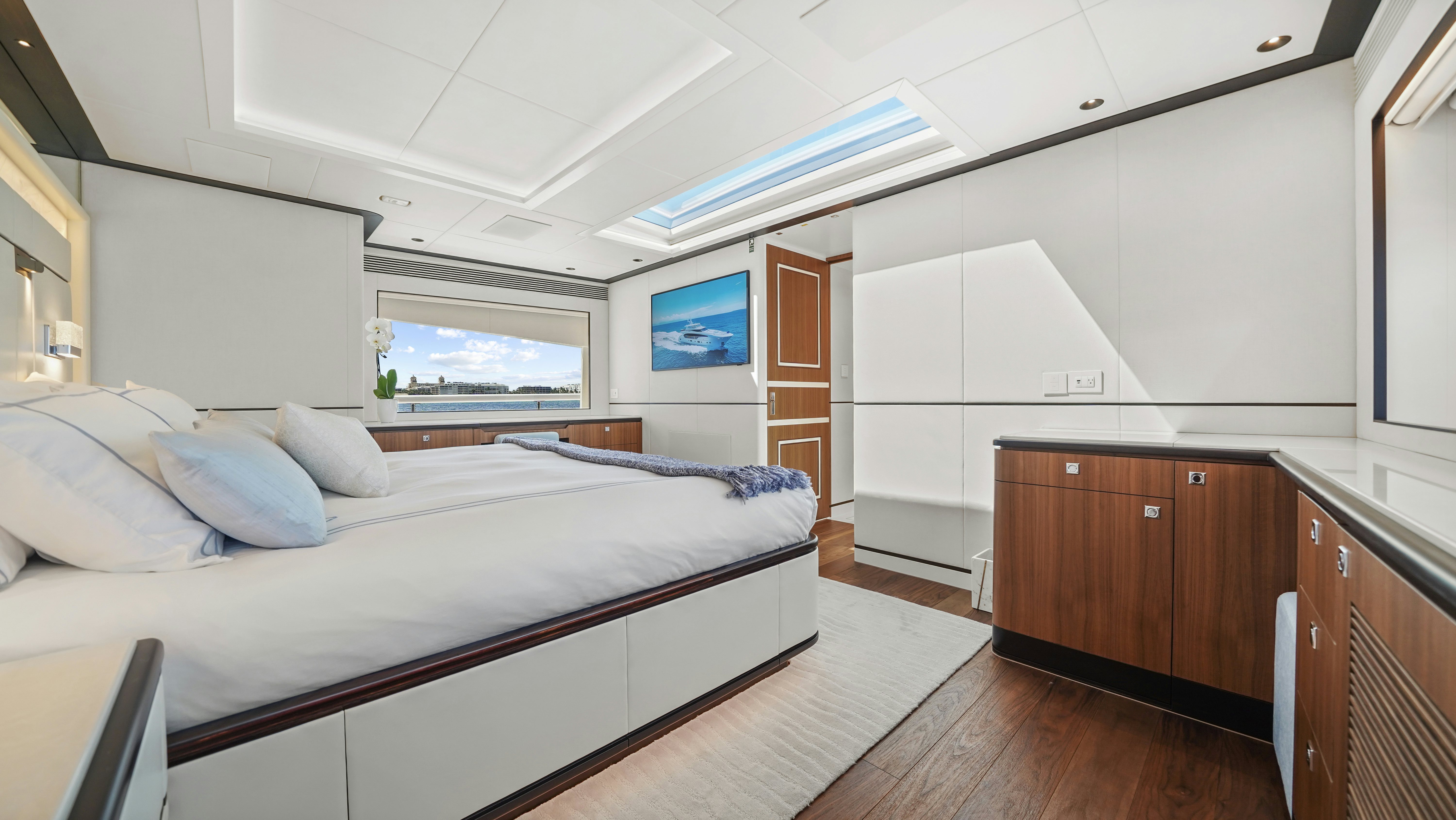 a bedroom with a large bed aboard MISS MICHELLE Yacht for Sale